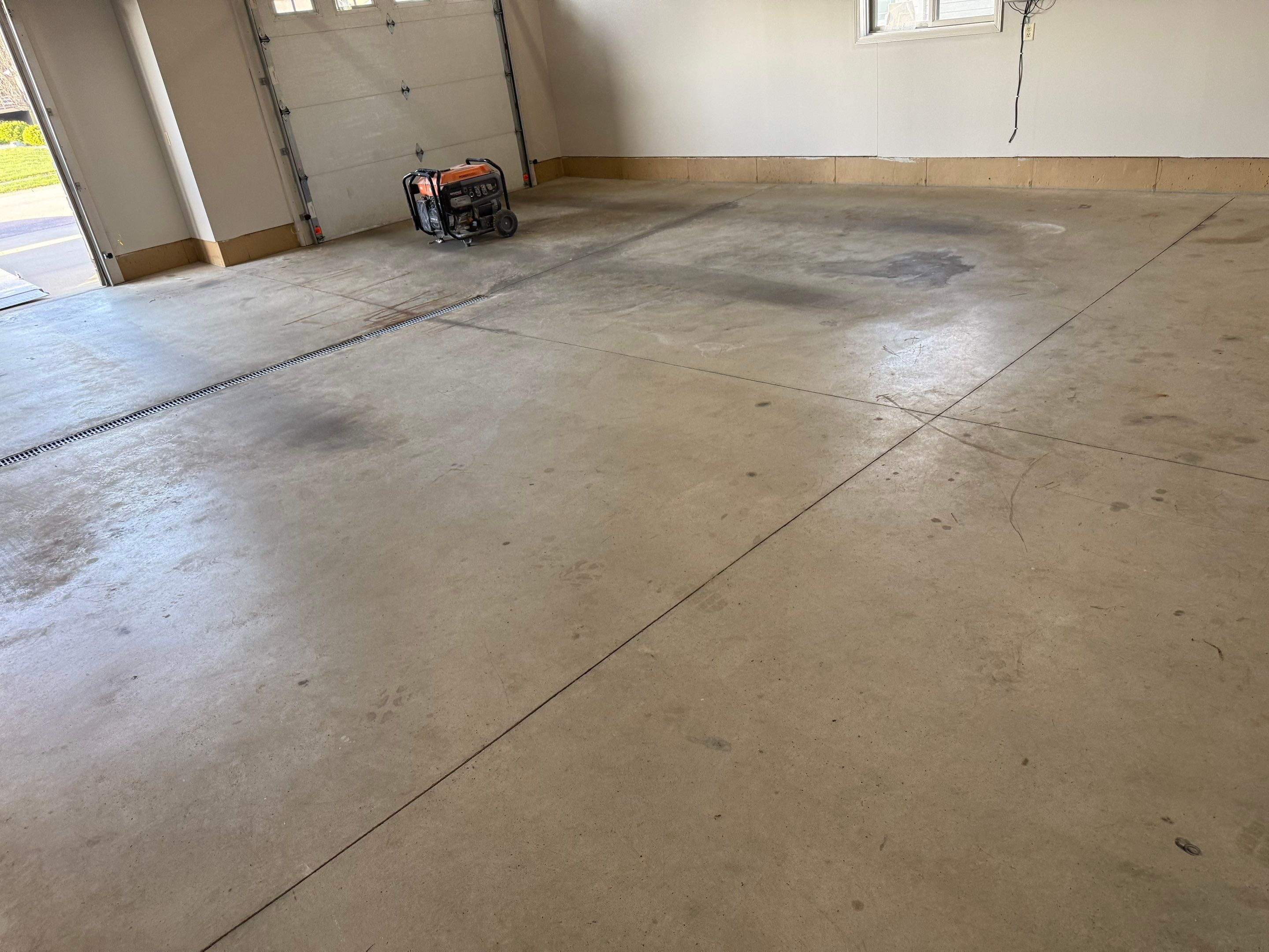 Multi-Car Garage Epoxy Floor Coating in Beresford by Select Painting, Coatings & Garage Cabinets