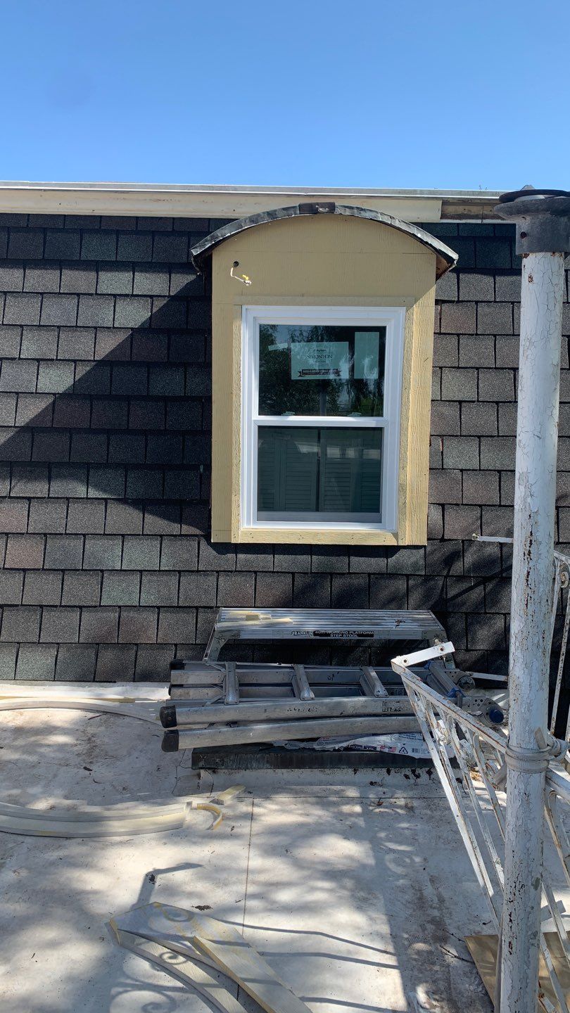 Mansard Charm by Bayfront Roofing and Construction