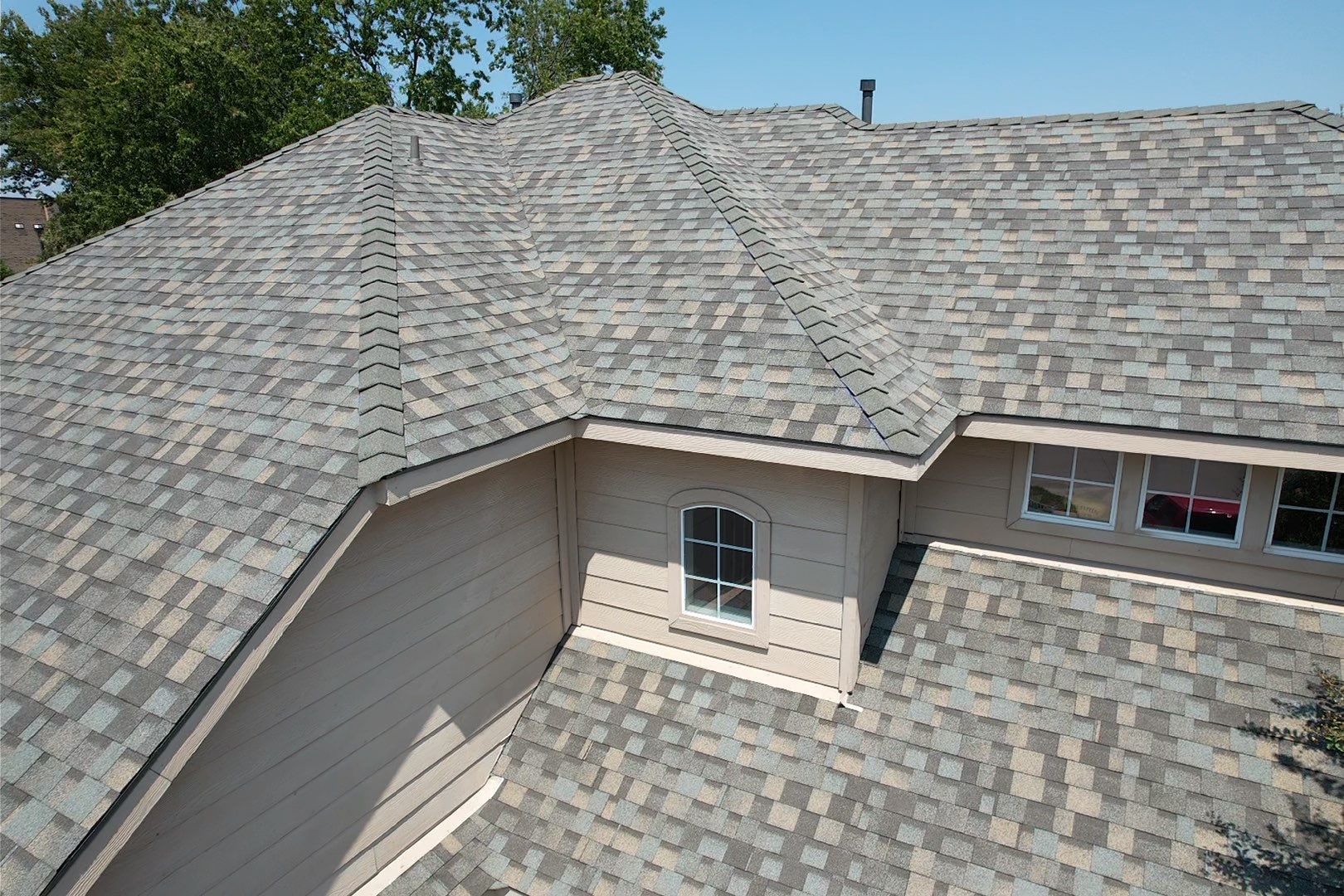 Red brick/white stone with IKO Cornerstone by Tejas Roofworks + Restoration