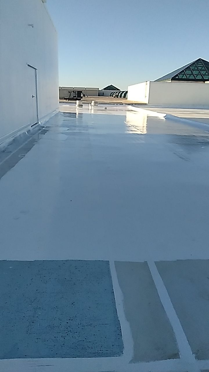 Silicone Roof Coating and Parapet Wall Repairs in South Bradenton by CES Roofing