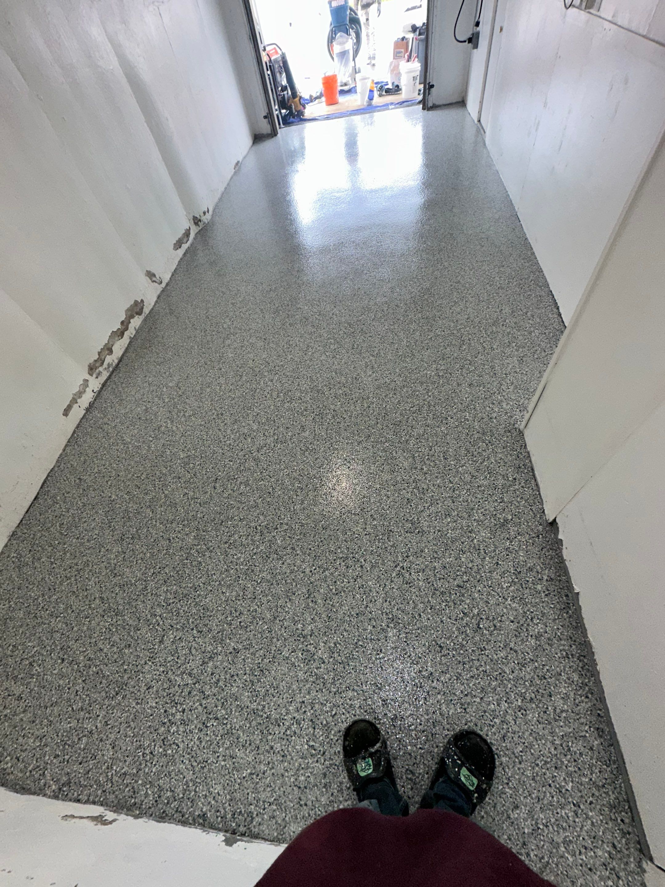 Garage Concrete Floor Coating Transformation  by DiGiorgi Roofing and Siding Inc