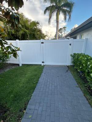 White Vinyl Privacy Fence and Chain Link Installation in North Port