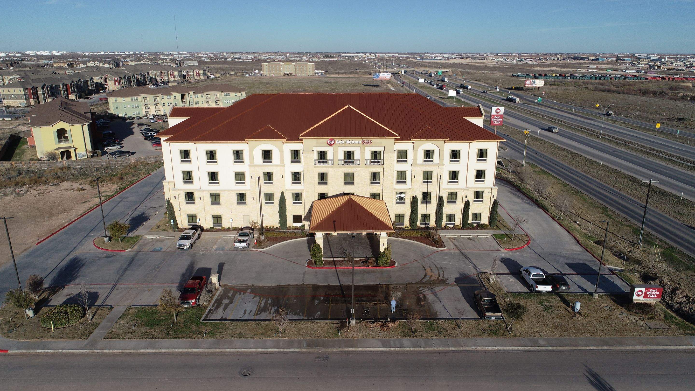 Commercial Roof Replacement for Best Western using Standing Seam Roofing - Midland, TX by Roof Experts