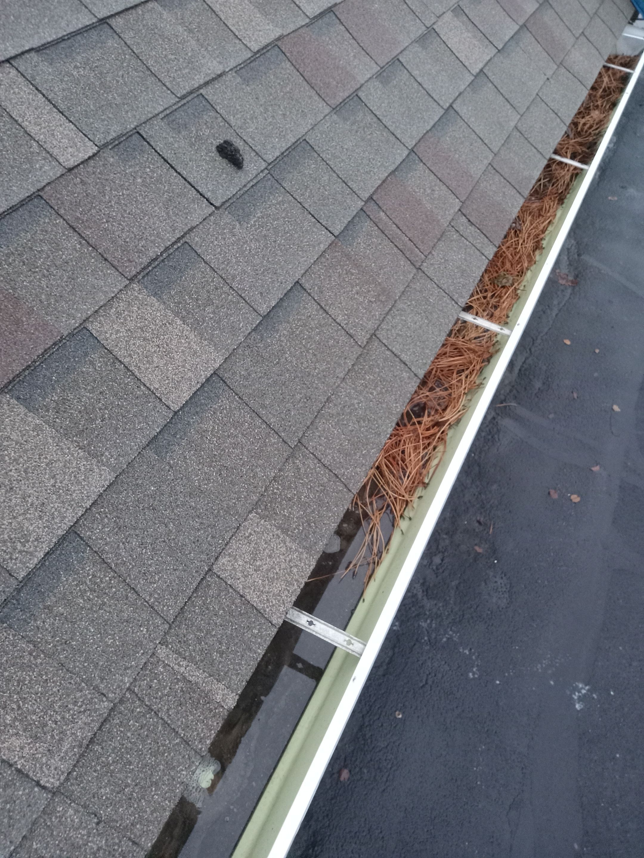Commercial gutter cleaning Wichita before photo with filled gutters