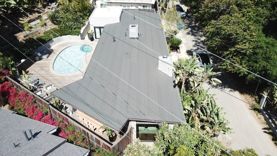 Residential Roofing Installation using Polyfresko® G Highly Reflective Modified Bitumen Cap Sheet by Hull Brothers Roofing
