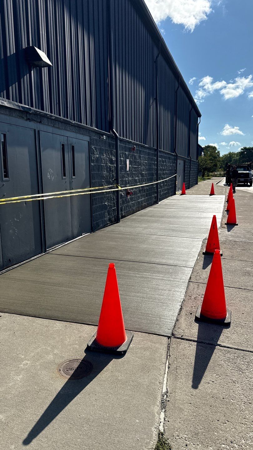 Broom finished concrete patio  by NG Masonry & Construction LLC