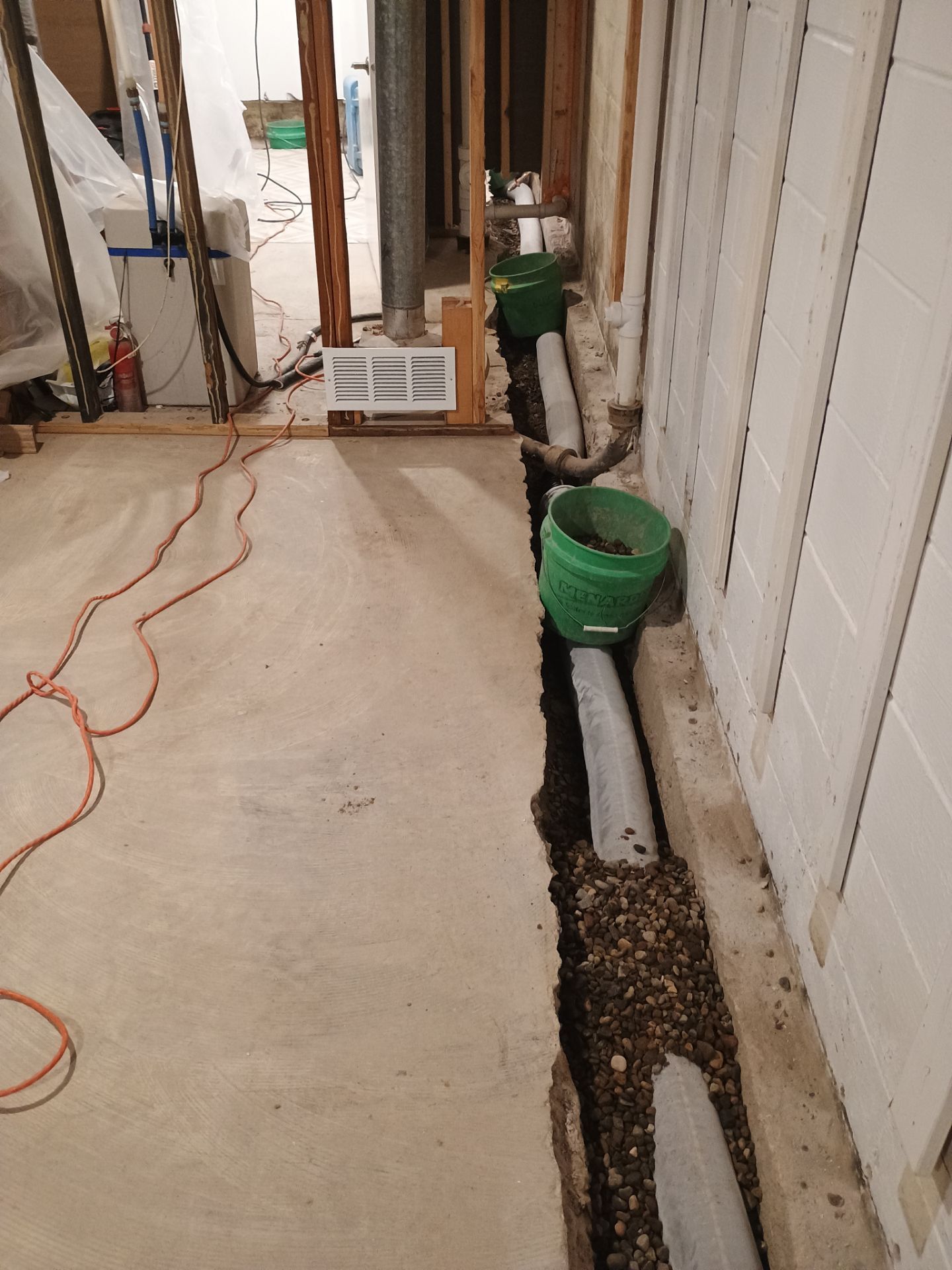 Interior Drain Tile & Buried Discharge in St. Anthony, MN by Waterproofing Northeast
