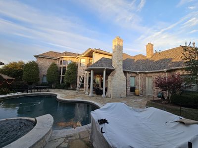 Light red brick/cream stone/espresso shutters with IKO Cornerstone