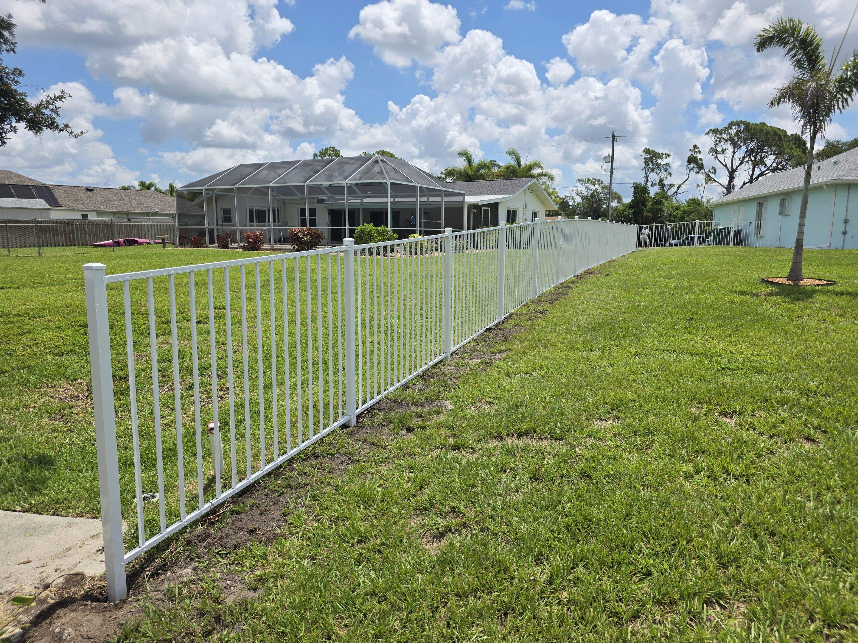 White Aluminum Picket Fence Installation for Port Charlotte Waterfront Home by True Fence LLC