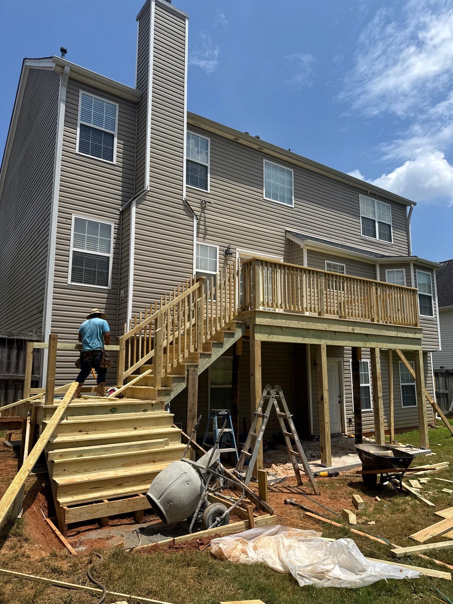 Backyard Deck Expansion & Custom Staircase Installation in Suwanee. by Swift Home Renovations