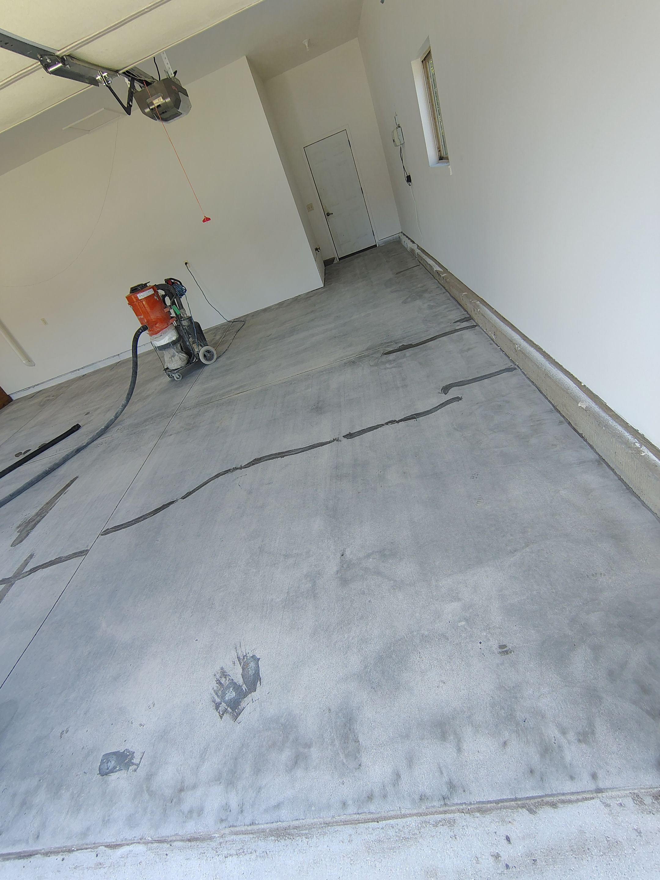 Custom Grey Speckled Epoxy Floor Coating for Sioux Falls Garage by Select Painting, Coatings & Garage Cabinets