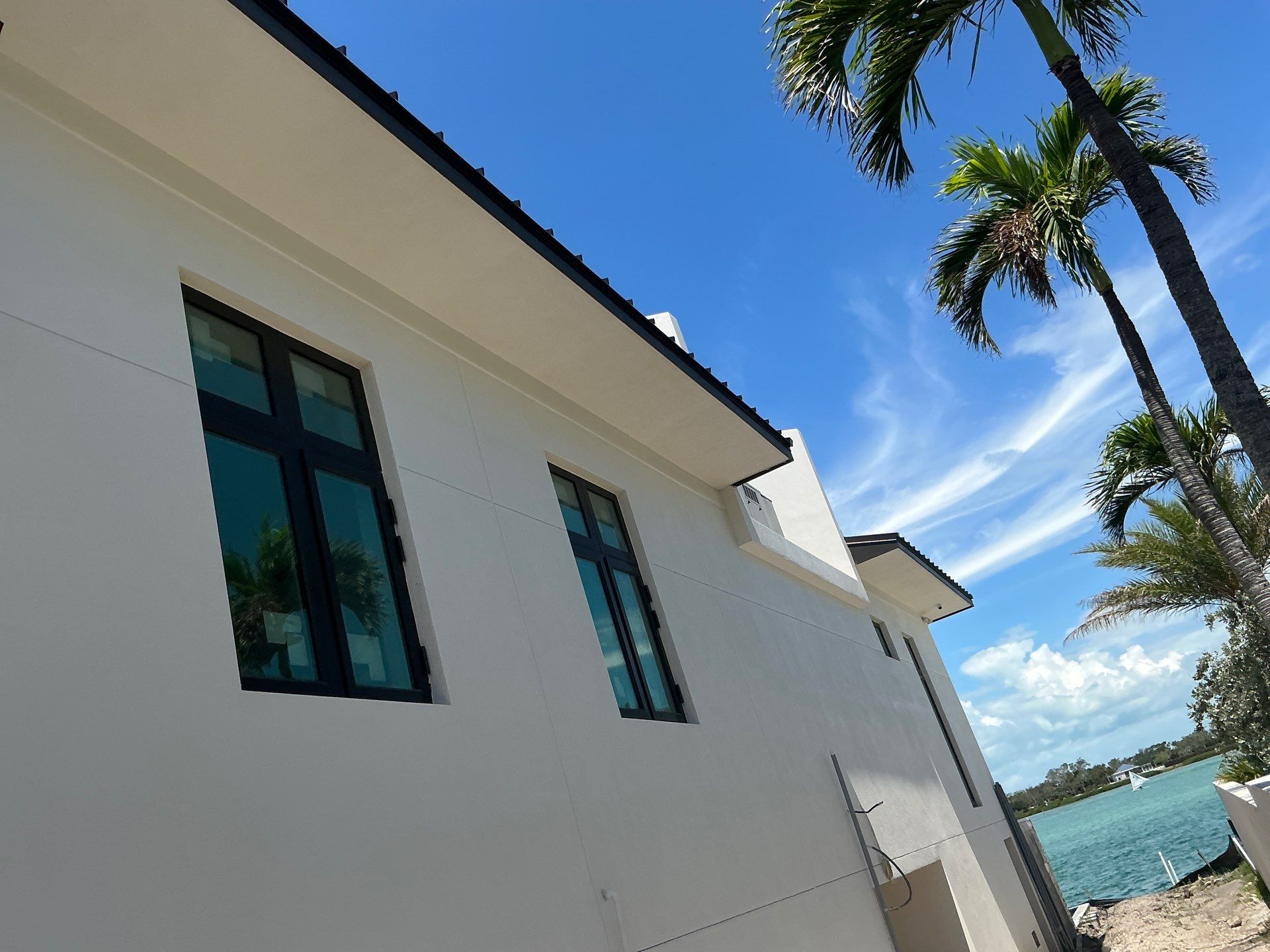 Seamless Aluminum Gutter Installation using black seamless gutters in Sarasota FL by Gutter Professors