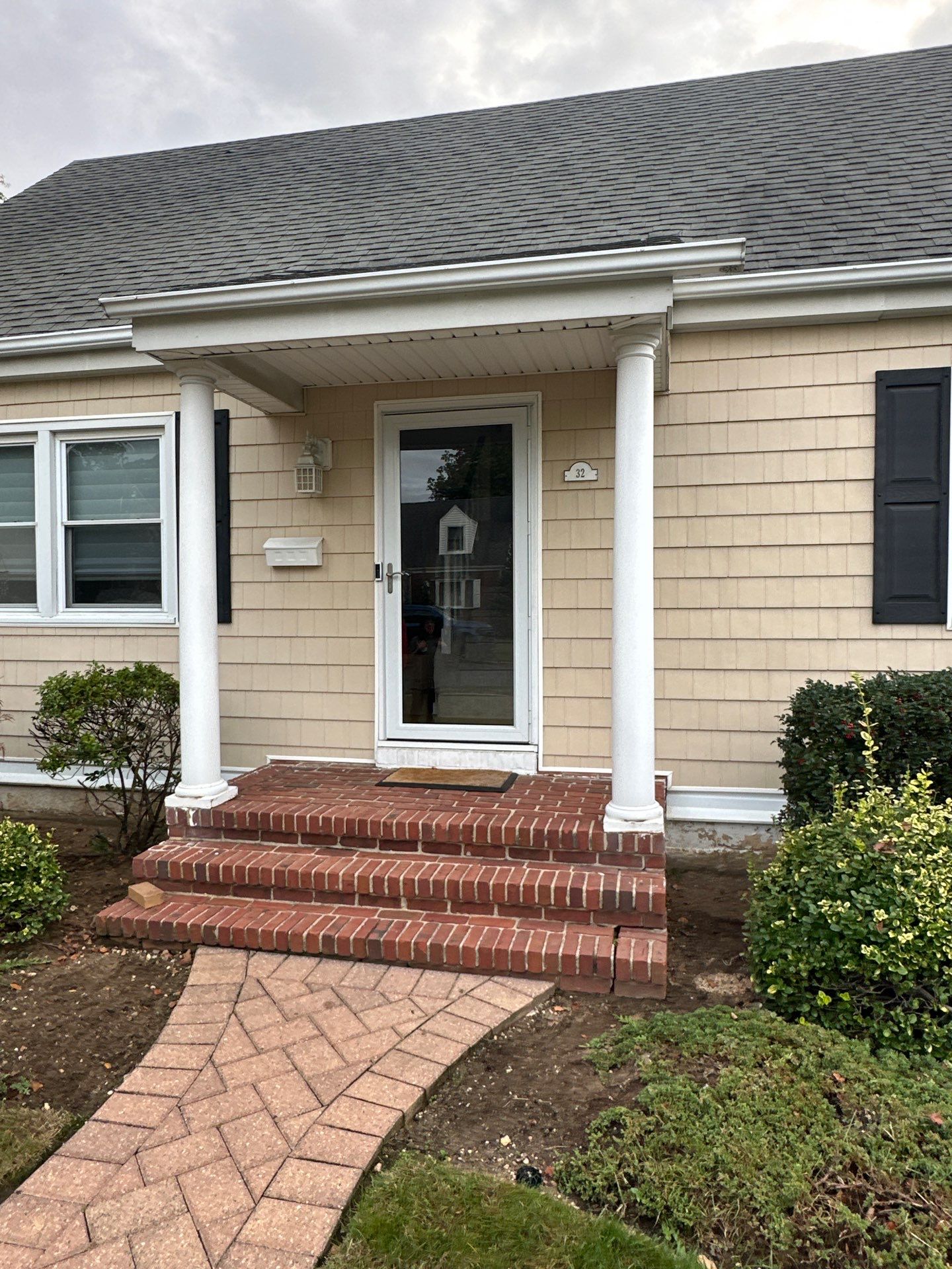 Gutter Installation using 5"white K style seamless gutters and 2x3 white leaders by Above All Gutters 