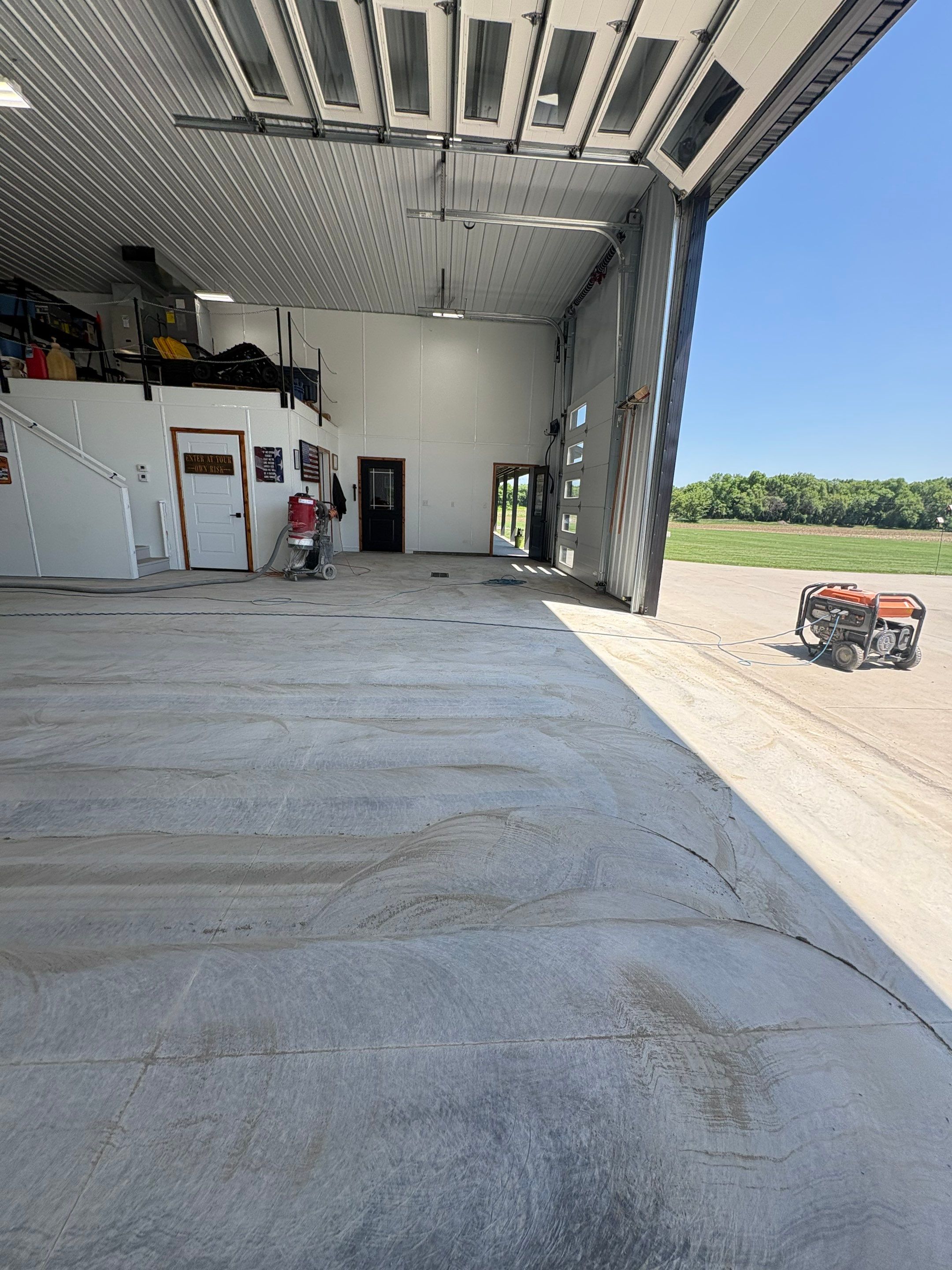 Multi-Stage Concrete Floor Coating for Egan Shop and RV Storage by Select Painting, Coatings & Garage Cabinets