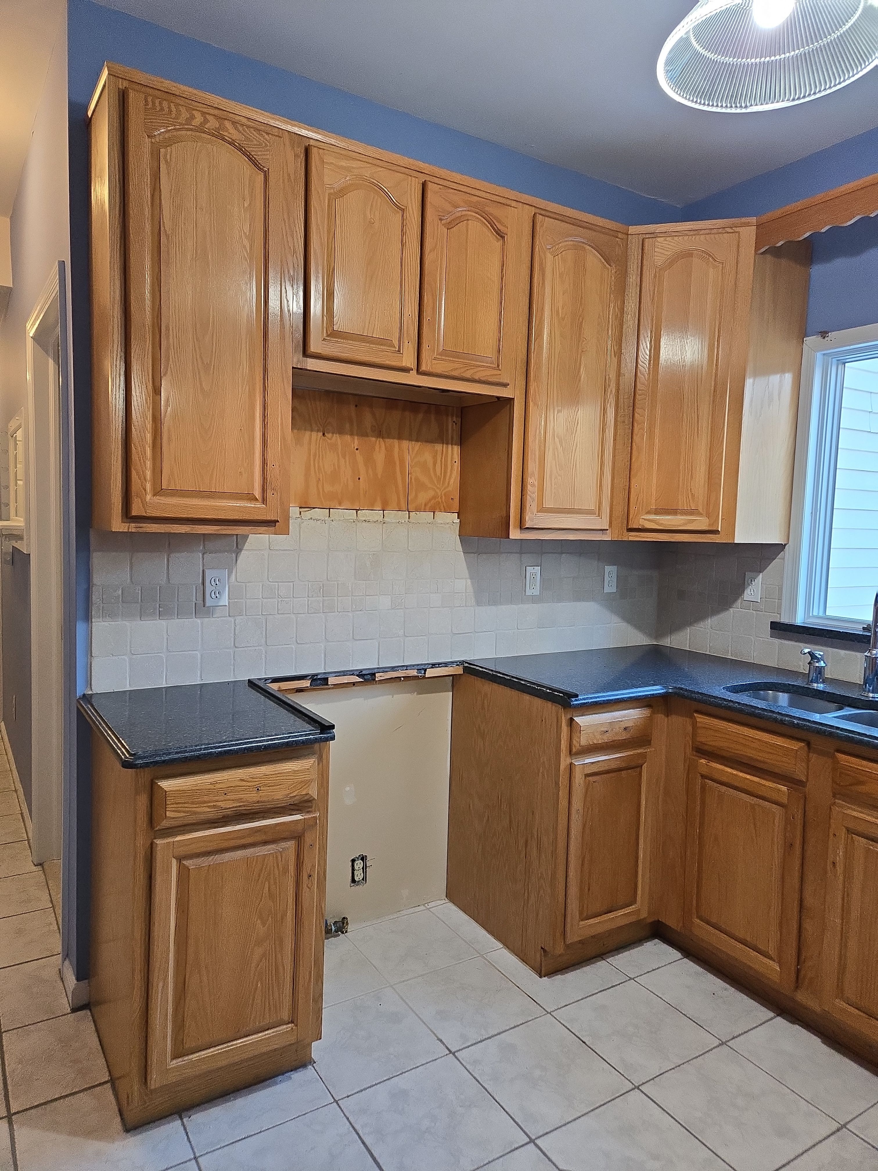 Cabinet Refinishing using Benjamin Moore Command by Spectrum Painting, LLC