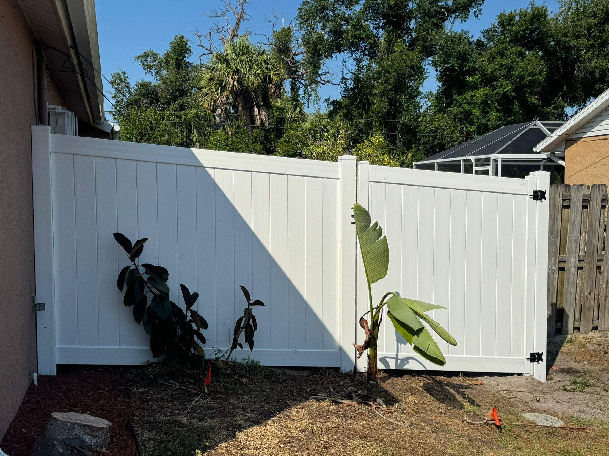 White Vinyl Privacy Fence and Gate Repair in North Port by True Fence LLC