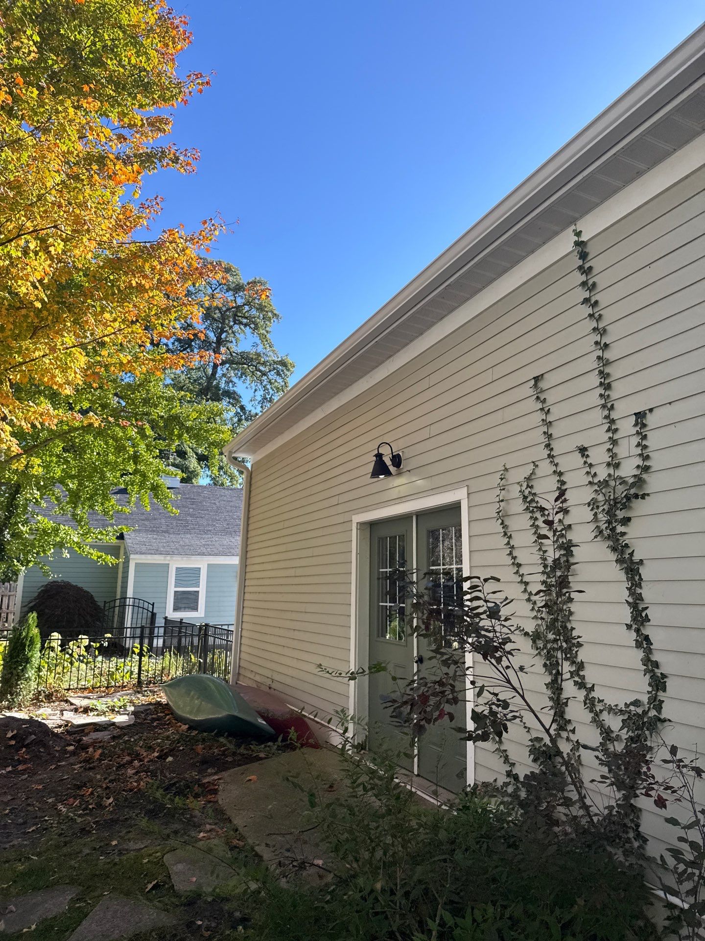 Seamless Gutter and Downspout Installation for Traverse City Garage by Rainbow Seamless Systems