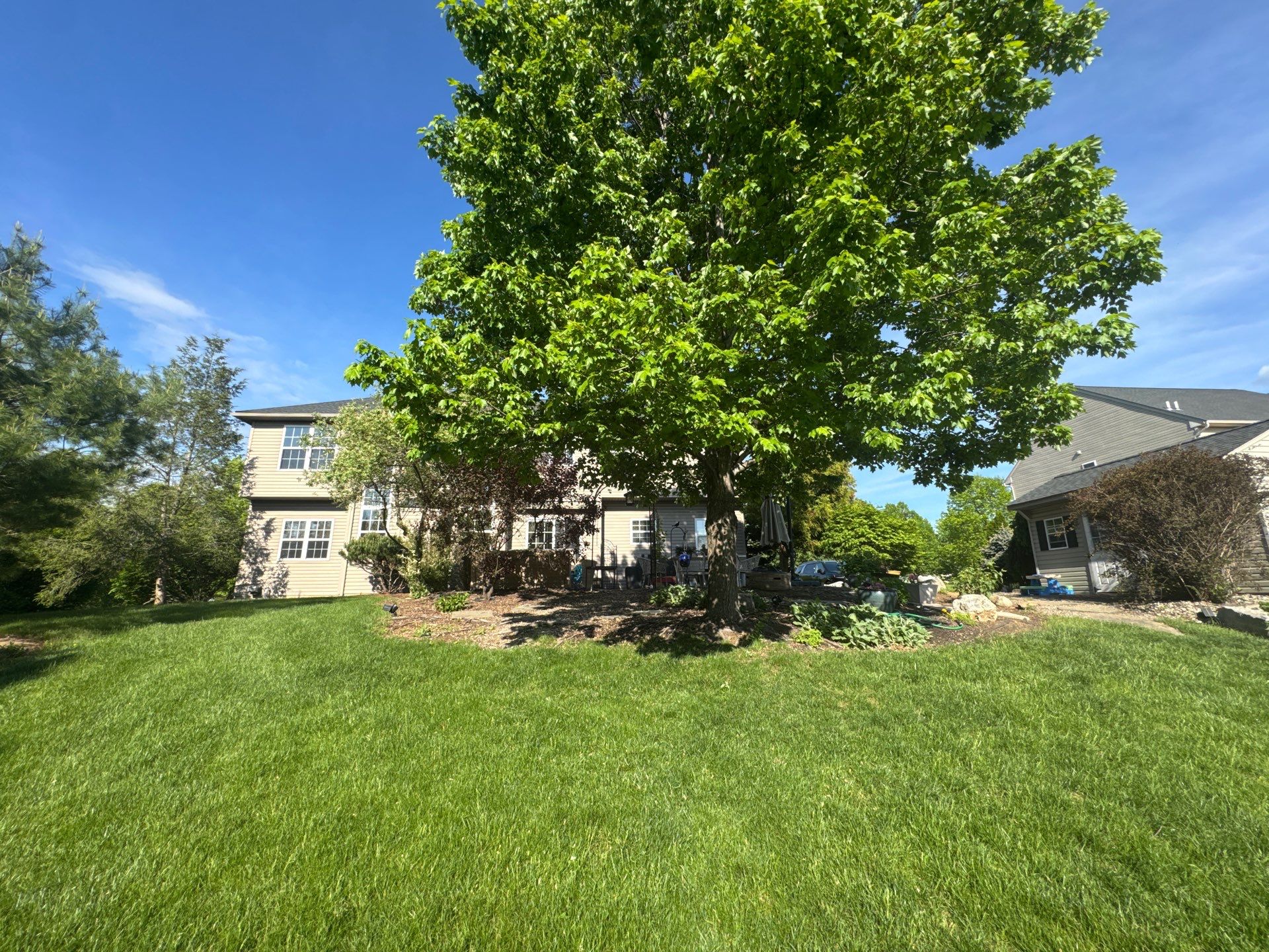 Backyard Retreat: Techo-Bloc Patio + Firepit Lounge by Saylor’s Lawn & Landscape