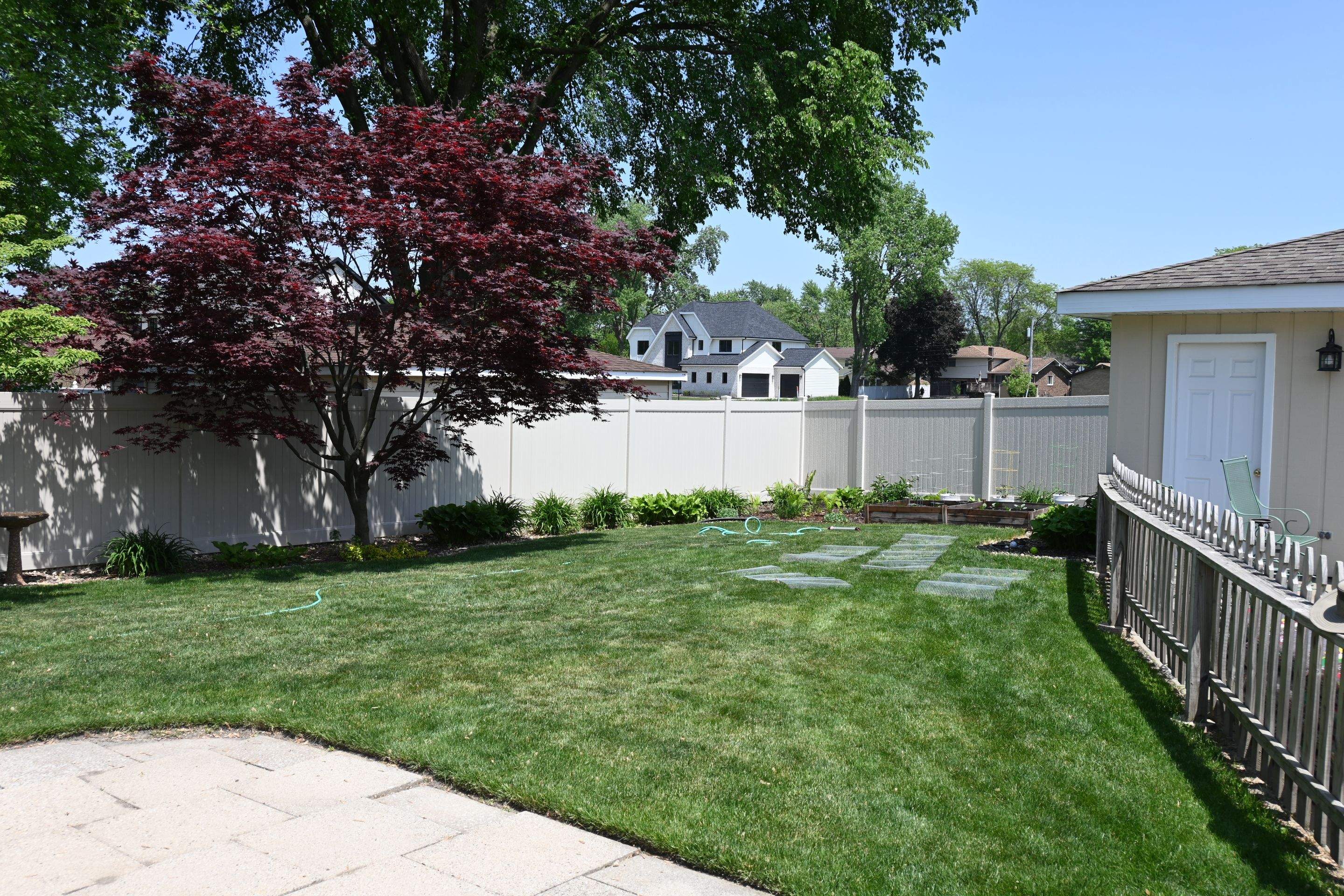 Vinyl Fence Installation in Backyard by Kraz Construction