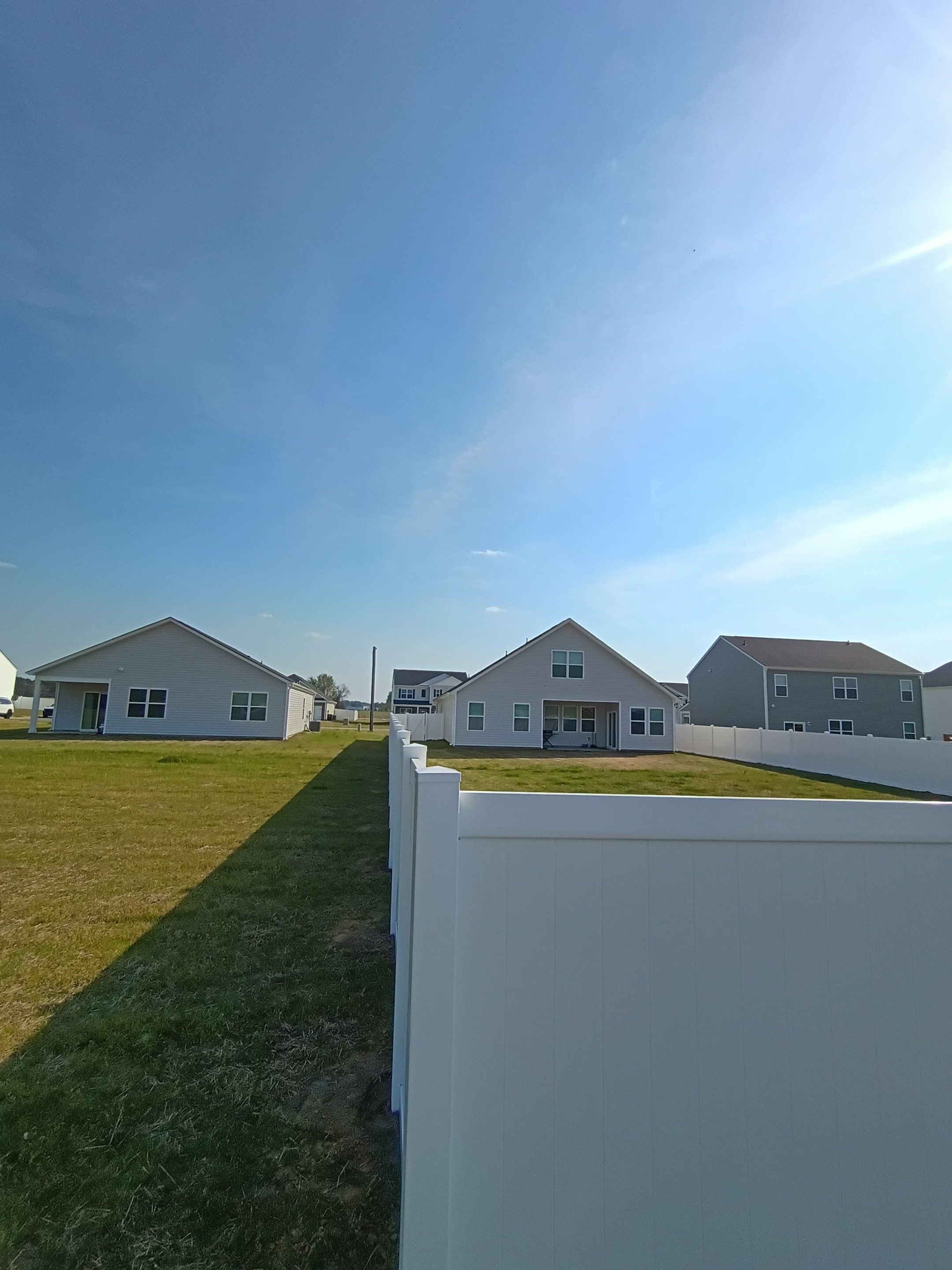 White Vinyl Privacy Fence Installation in Ayden, North Carolina by Superior Fence and Rail