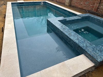 Geometric Pool with Raised Stone Spa