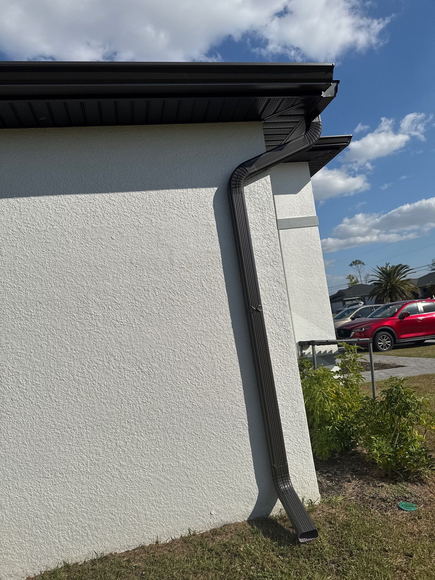 Dark Seamless Gutters and Downspouts in Cape Coral FL by Gutter Professors