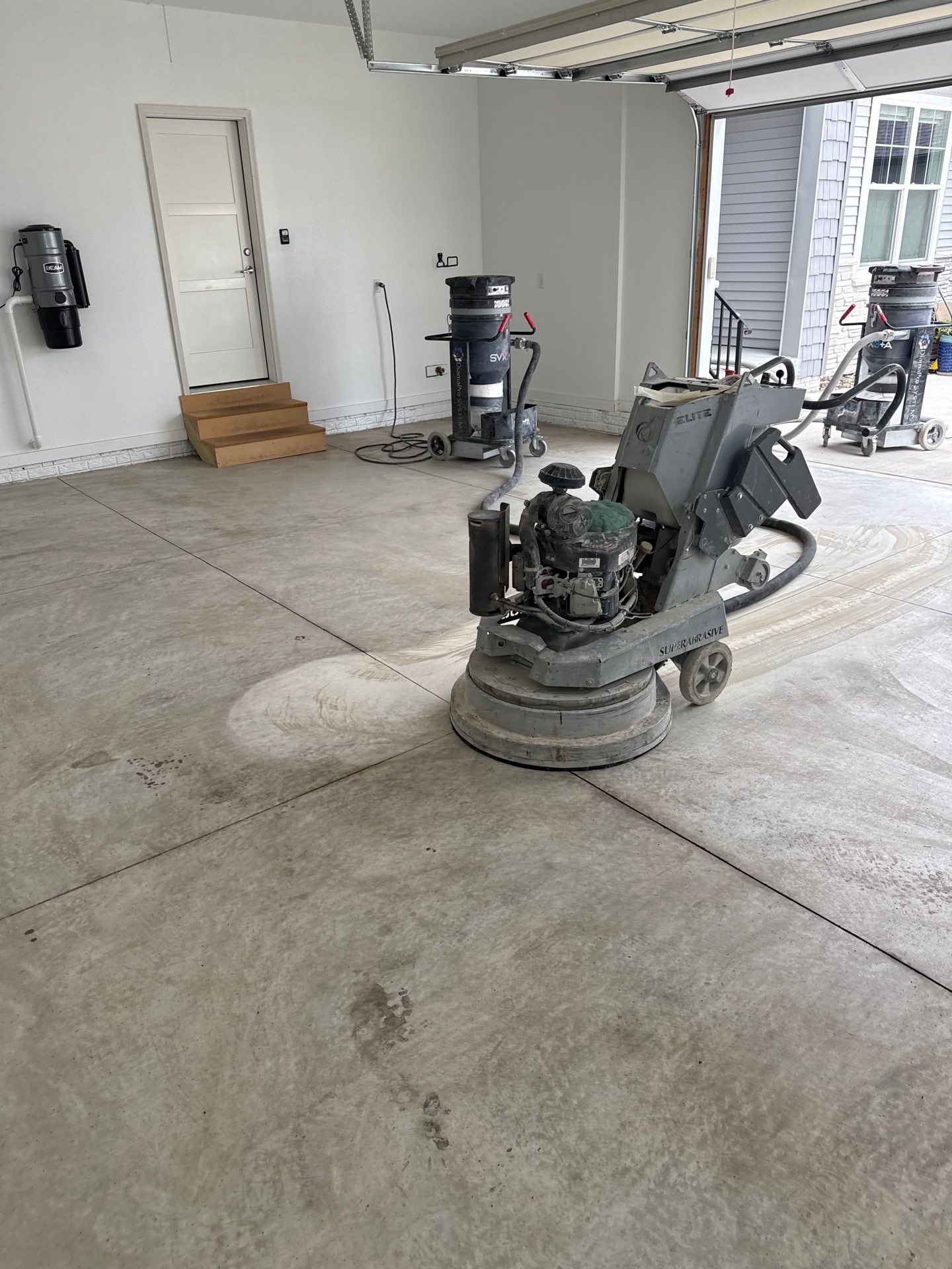 Gravel Flake Garage and Patio Floor Coating for Boone Residence by Revival Concrete Coatings