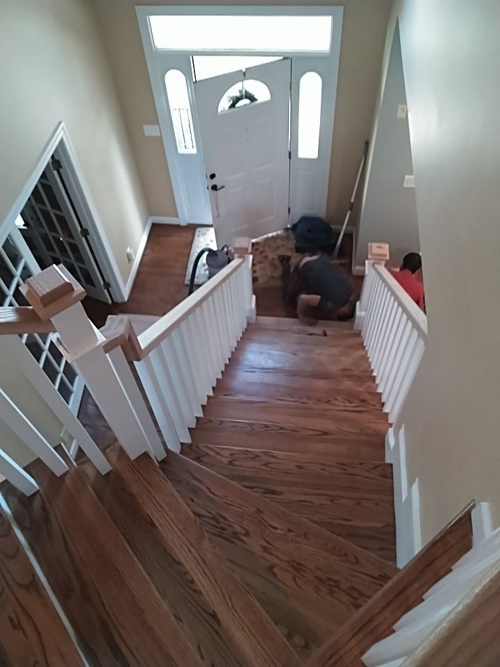 Stairway Installation using Red oak modern railings by House Custom Carpentry, LLC