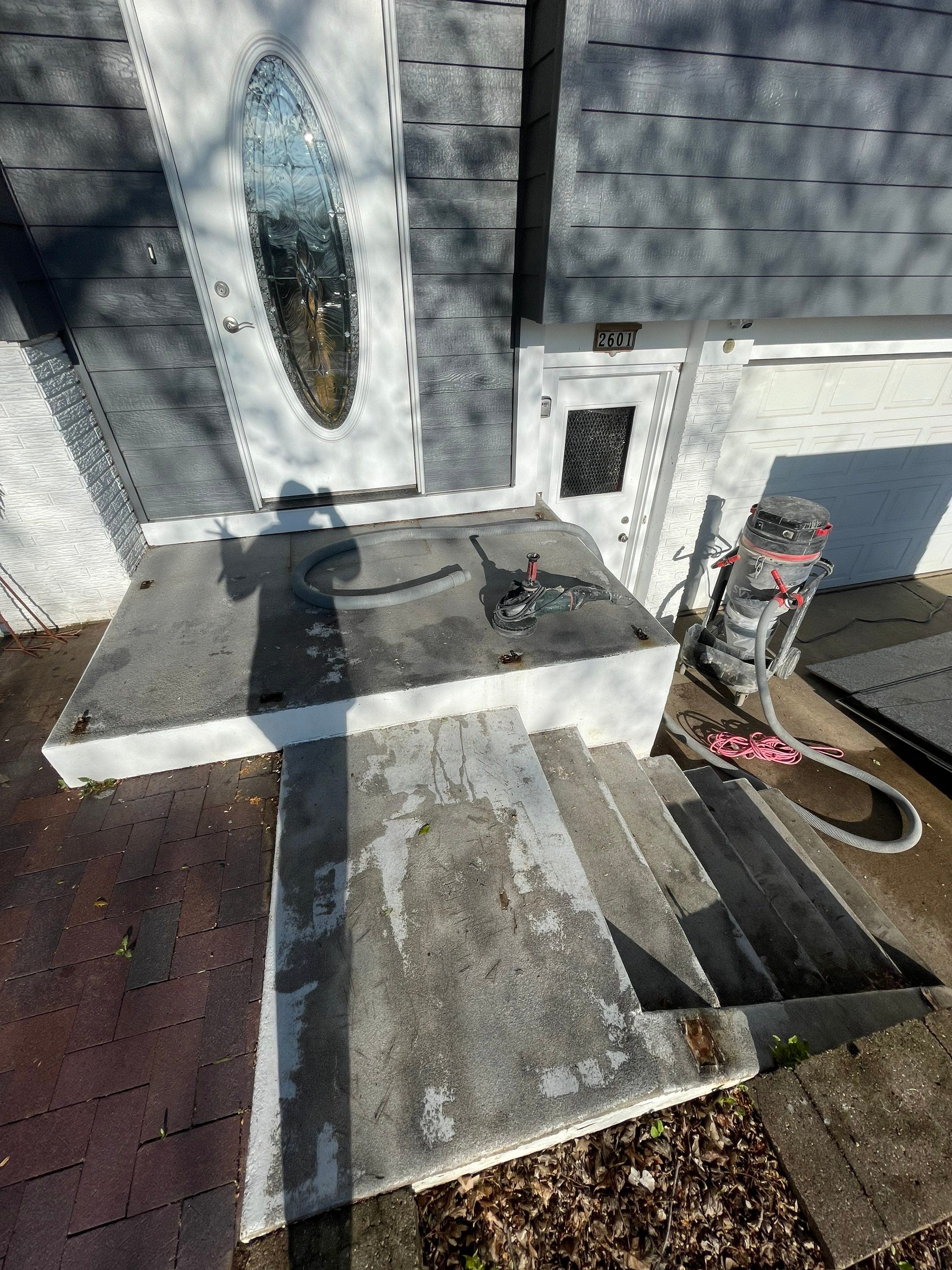 Grey Polyaspartic Porch and Stair Resurfacing in Sioux Falls by Select Painting, Coatings & Garage Cabinets