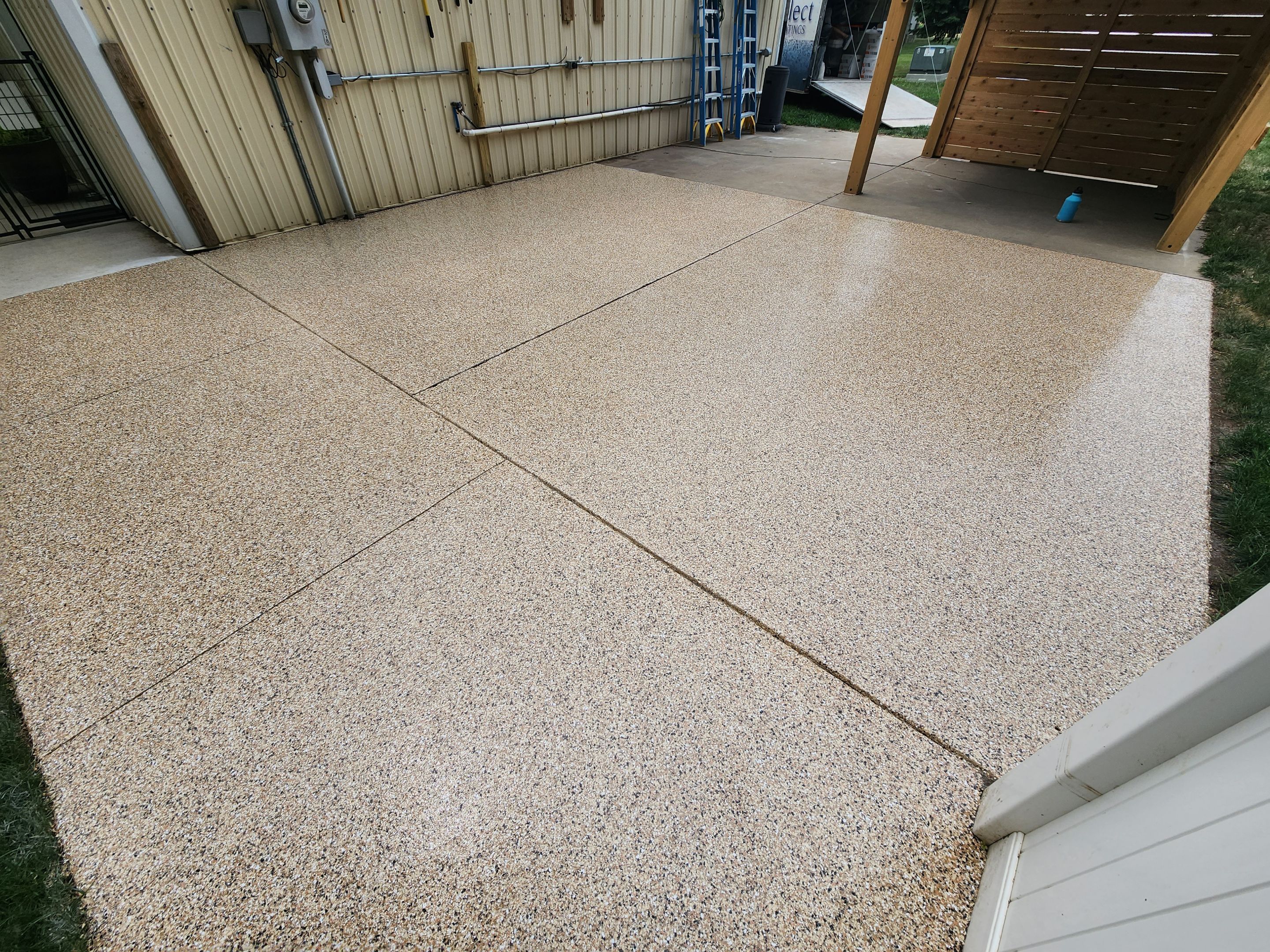 Speckled Epoxy Concrete Patio Coating Installation in Hurley by Select Painting, Coatings & Garage Cabinets