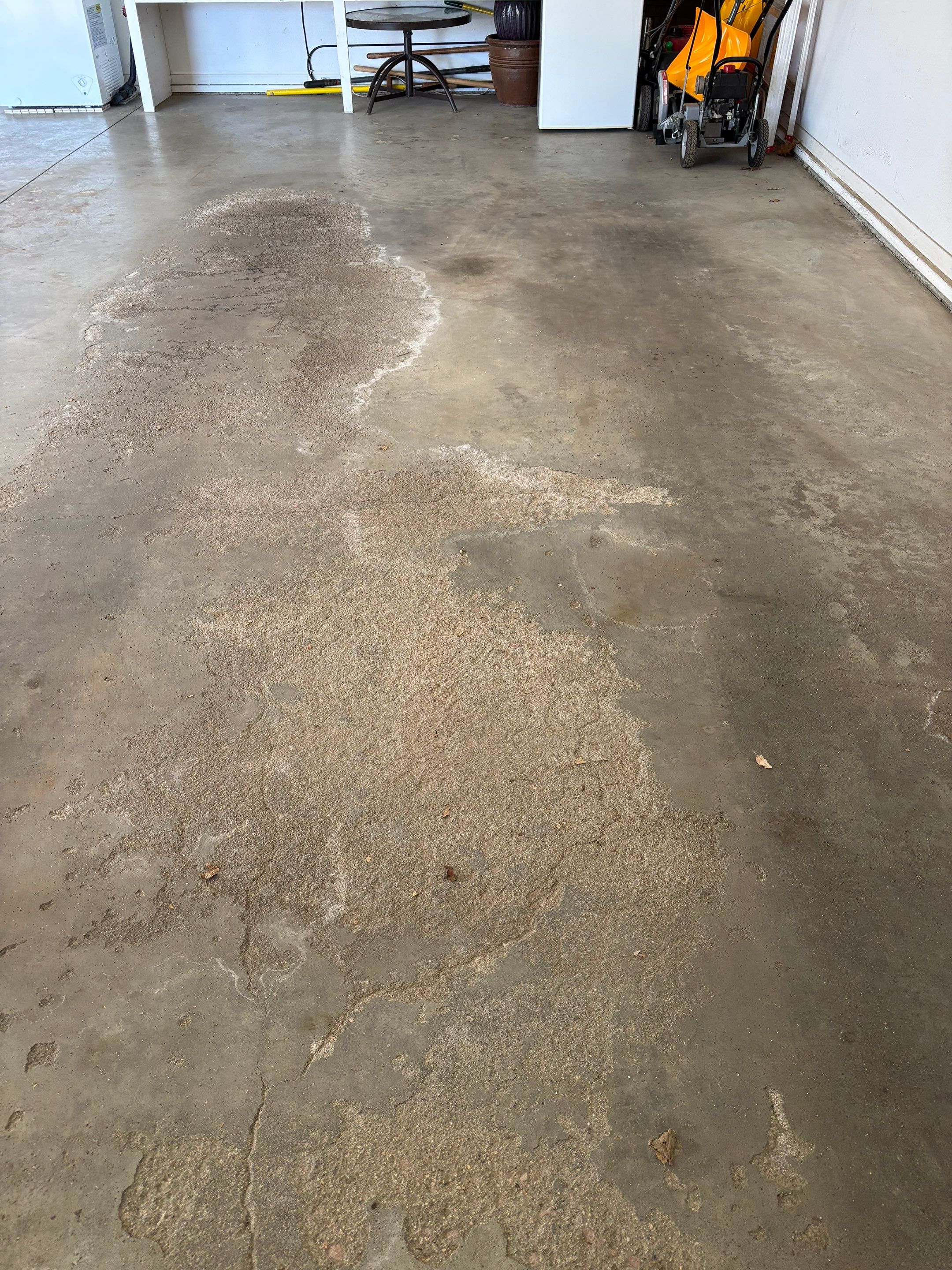 Yankton Garage Floor Restoration with Gray Speckled Epoxy Coating by Select Painting, Coatings & Garage Cabinets