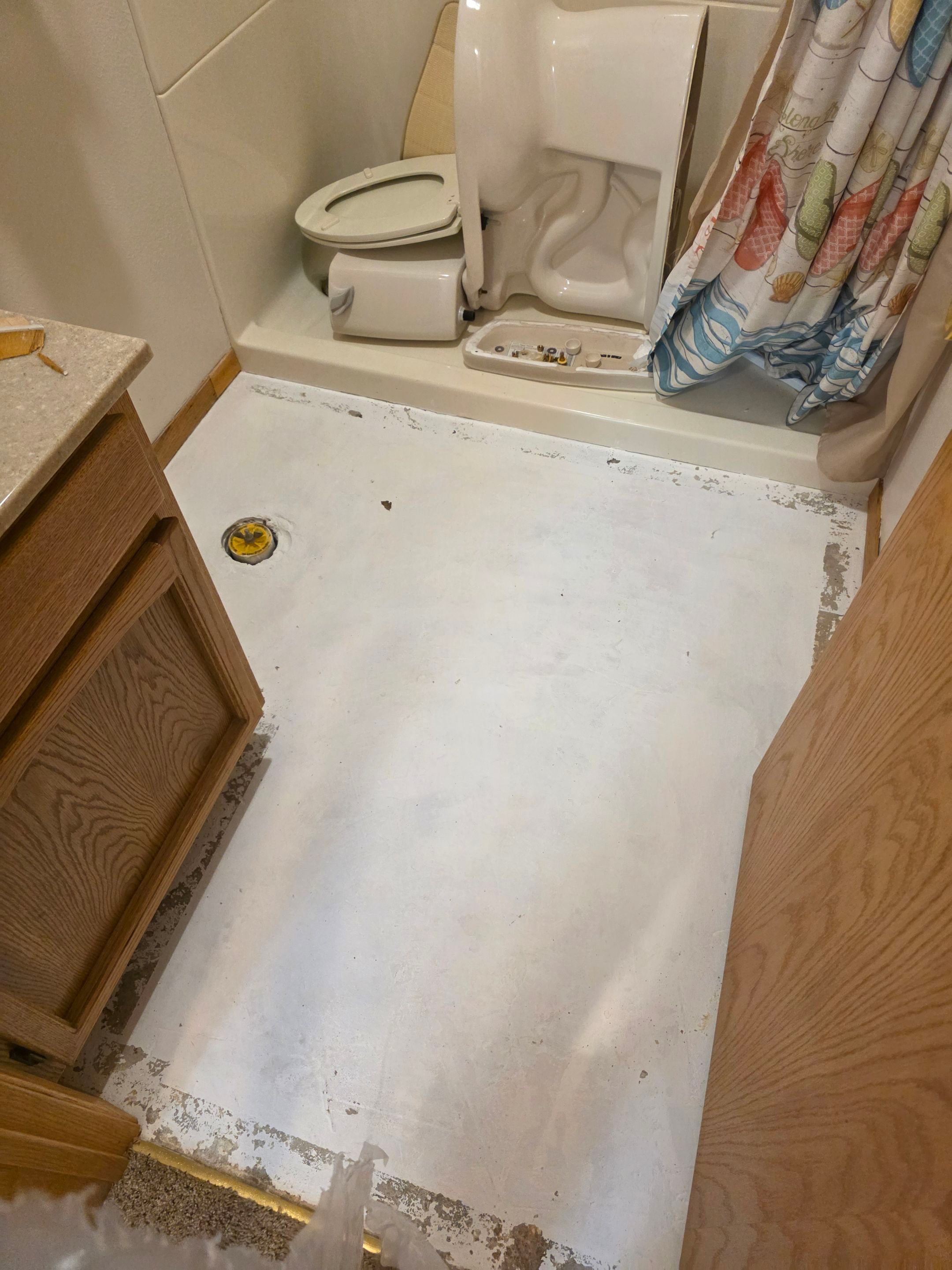 Full Garage and Basement Epoxy Floor Coating in Winner by Select Painting, Coatings & Garage Cabinets