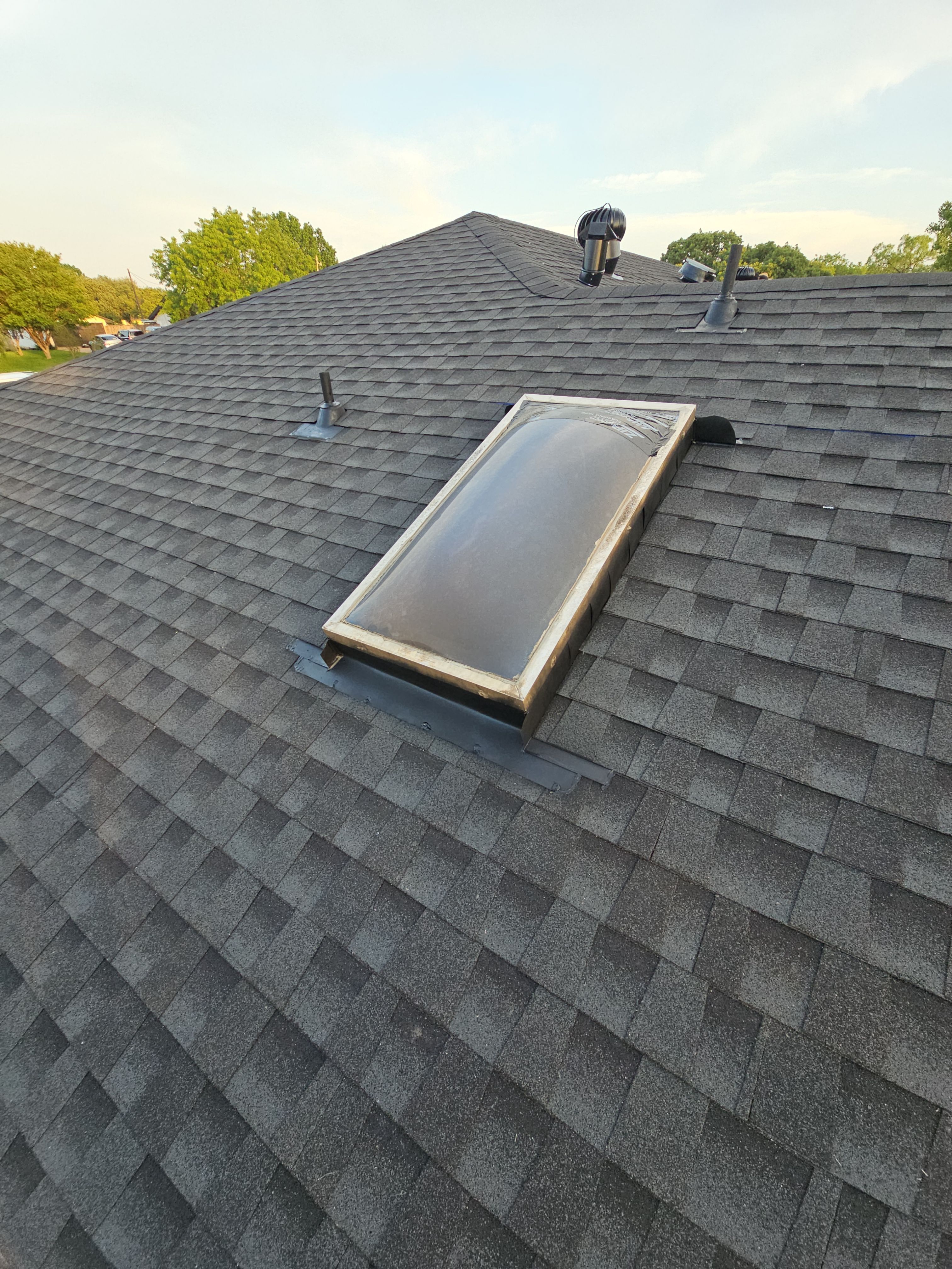 "Full Roof Replacement Due to Hail and Water Damage – Before & After" by road roofing llc