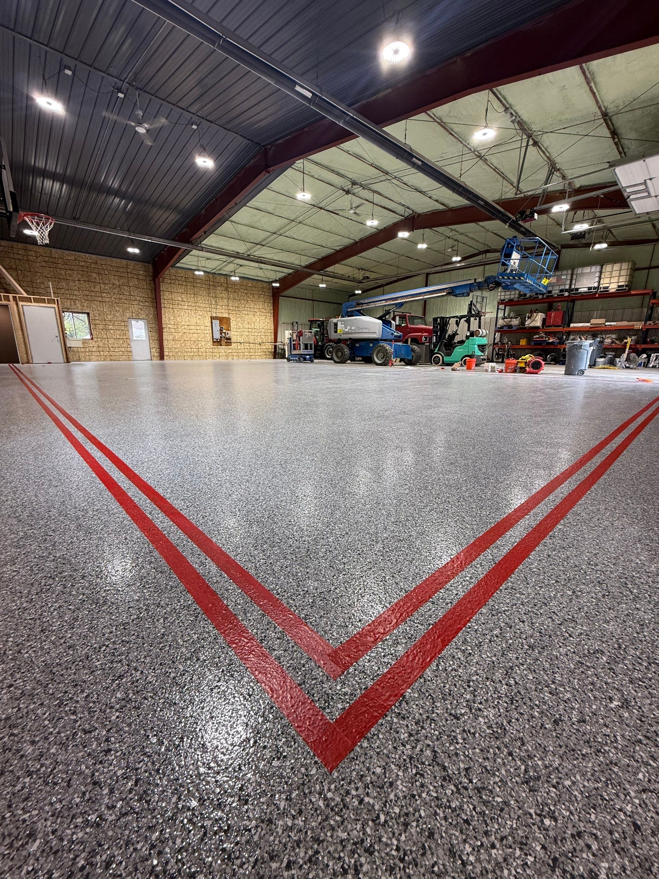 Custom Polyurea Shop Floor with Basketball Court Lines in Rock Valley by Select Painting, Coatings & Garage Cabinets