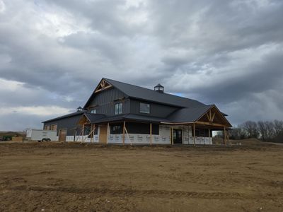New Home construction w/ board and batten sides and metal roof 