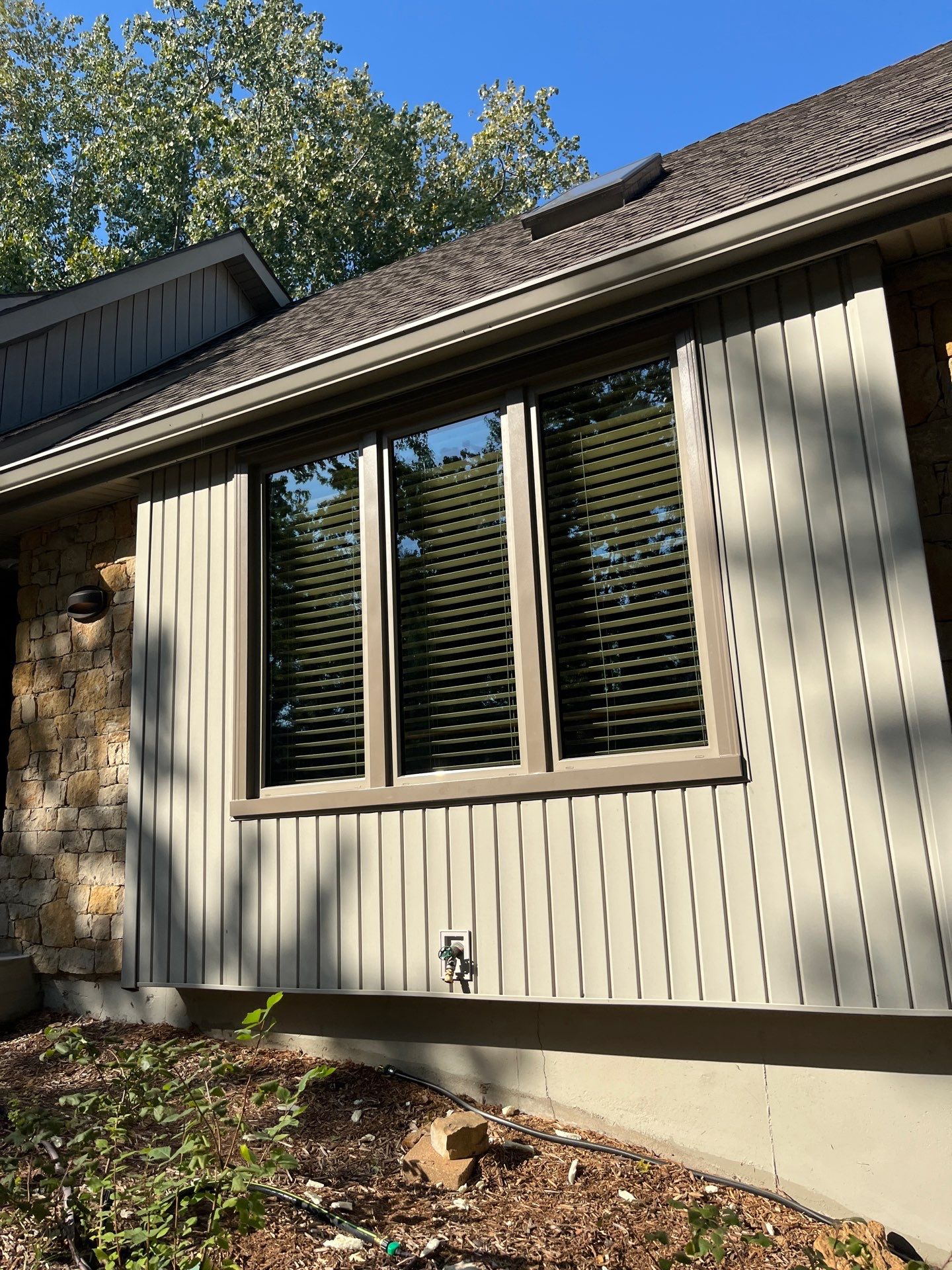 Comprehensive Kansas City Exterior Remodel Featuring Board And Batten Siding by EEC Windows, Siding & Roofing