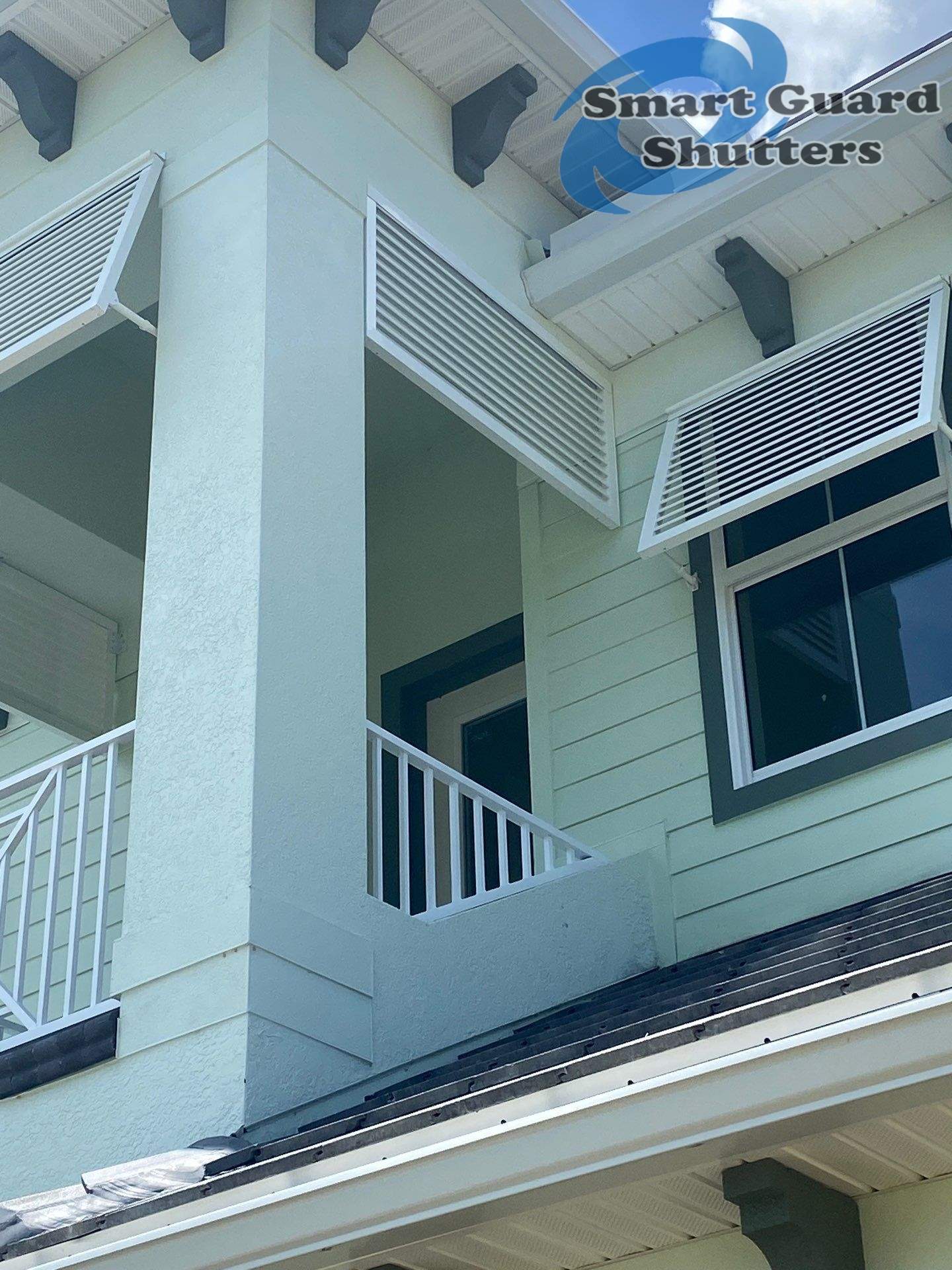 Decorative Bahama Shutters in Traffic White by Smart Guard Shutters
