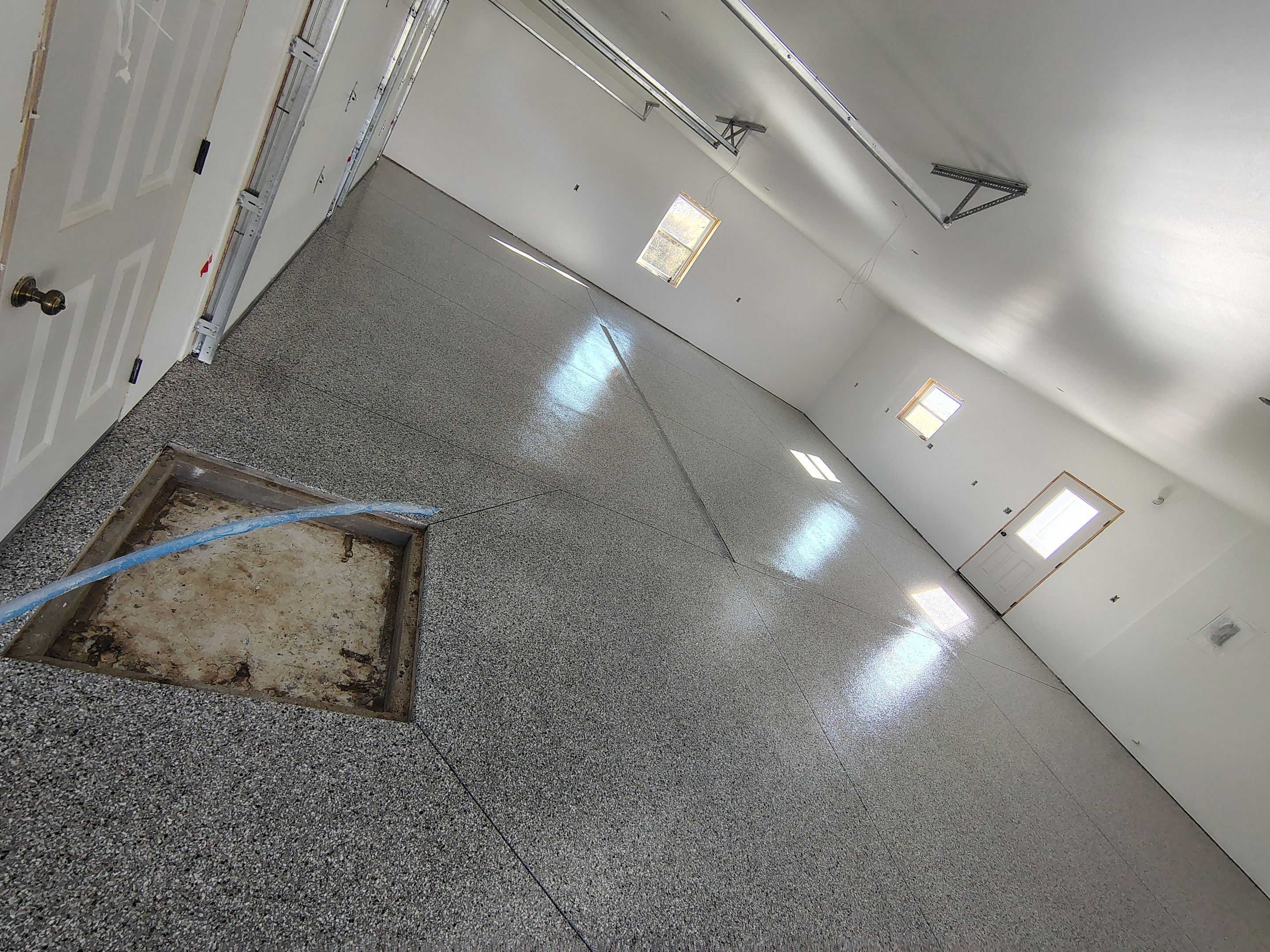 Custom Garage and Basement Epoxy Floor Coating in Menno by Select Painting, Coatings & Garage Cabinets