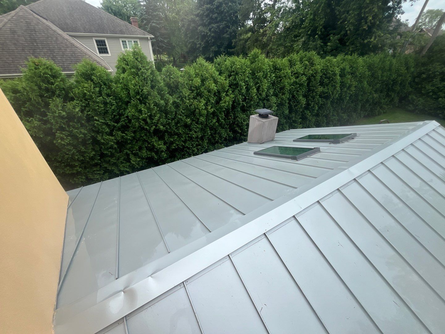 roof washing using Algaecide, soft wash soap by Northern Power Washing LLC.