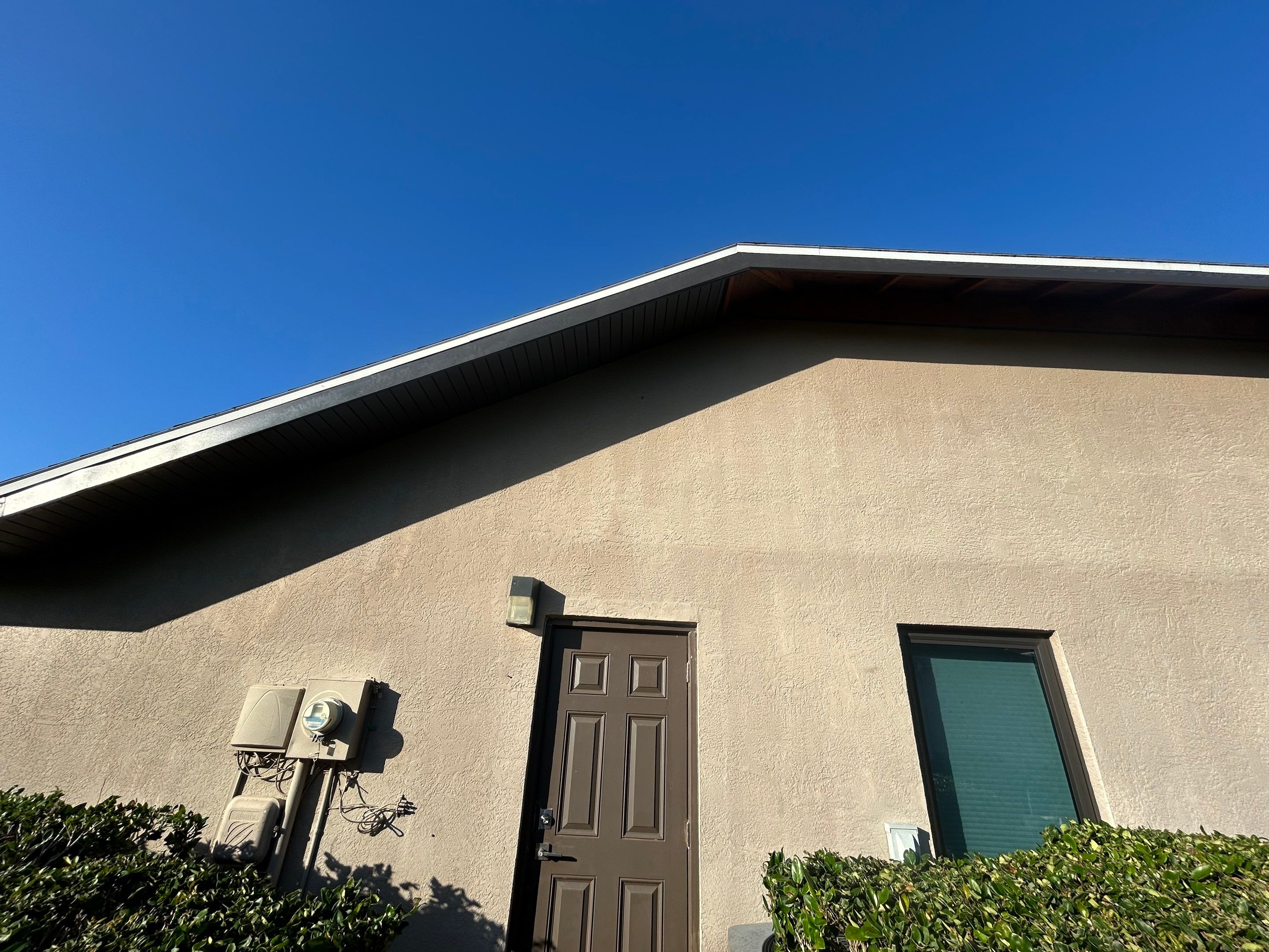 Black Seamless Gutters in Sarasota FL by Gutter Professors