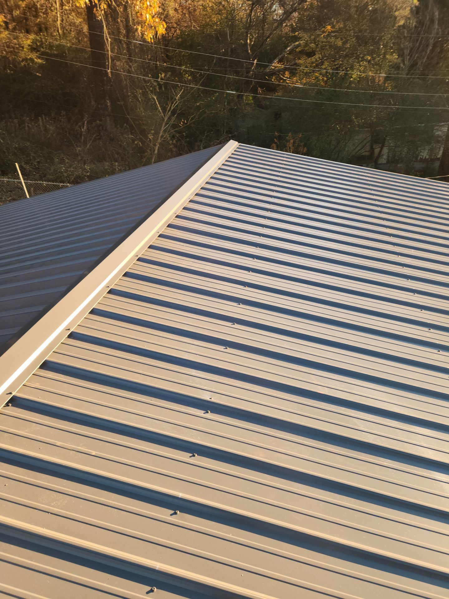 Roof Replacement in Pinson (Metal Roof) by The Roofing Dudes