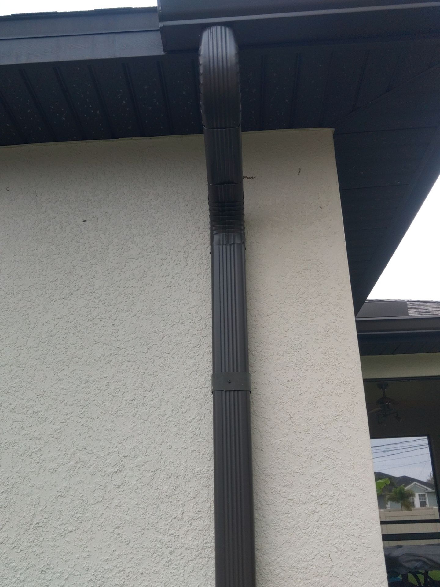 Black Seamless Gutters using black seamless gutters in Cape Coral FL by Gutter Professors