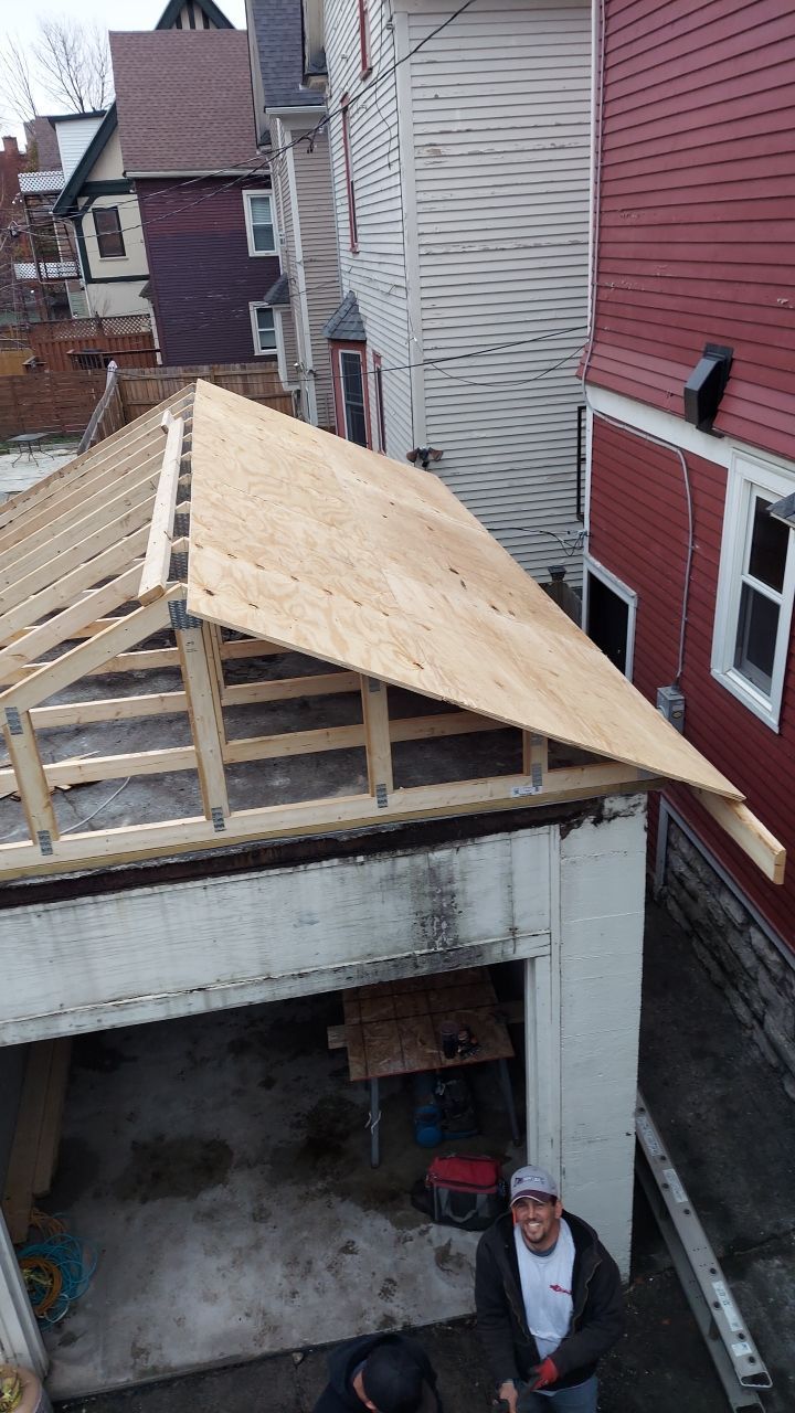 Exterior Renovations- Siding, Stamped Concrete, Porch, and Railings by Ivy Lea Construction