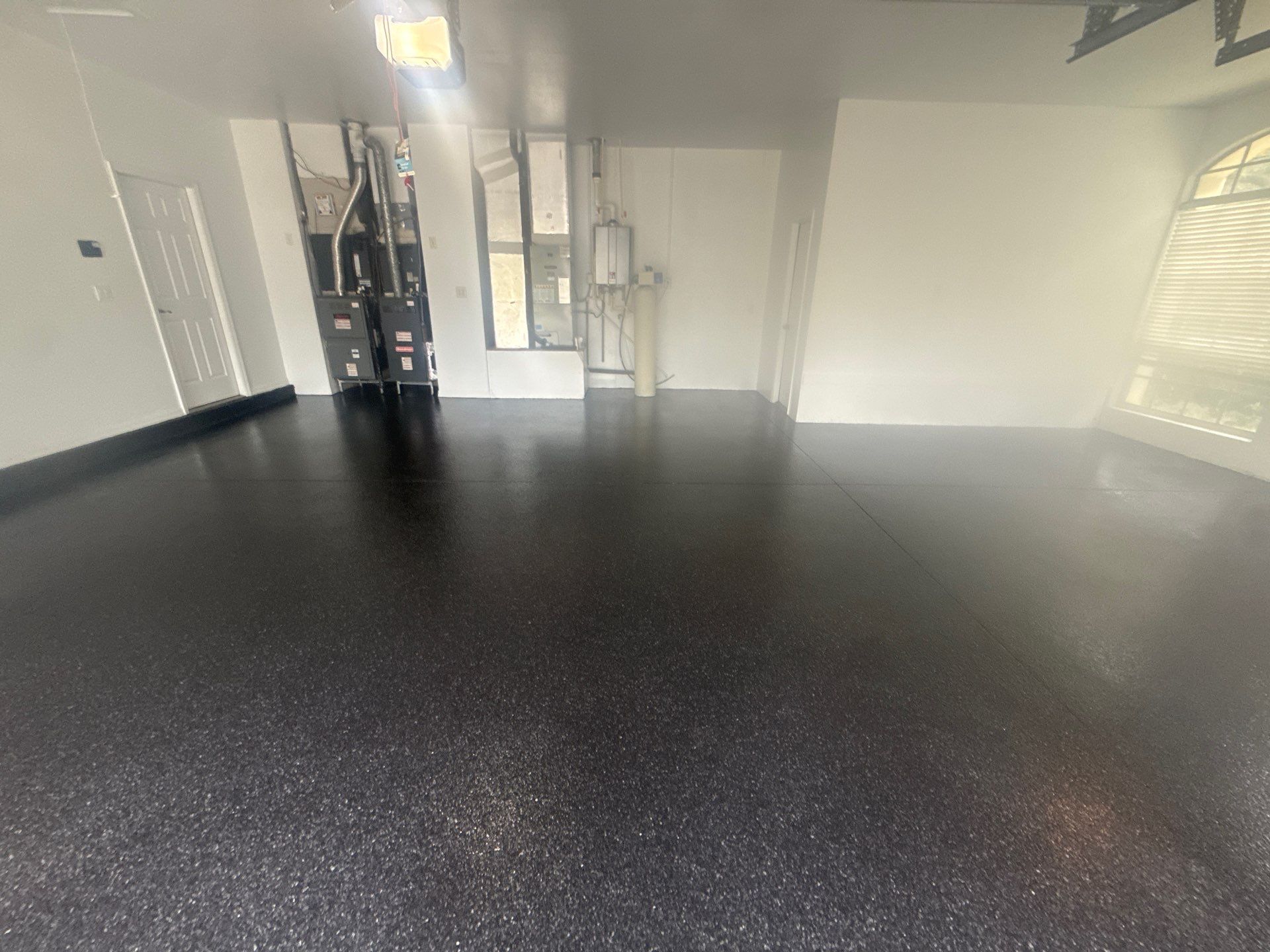 Tampa Garage Floor Coating and Overhead Storage Rack Installation by Square 1 Garage and Closet Solutions