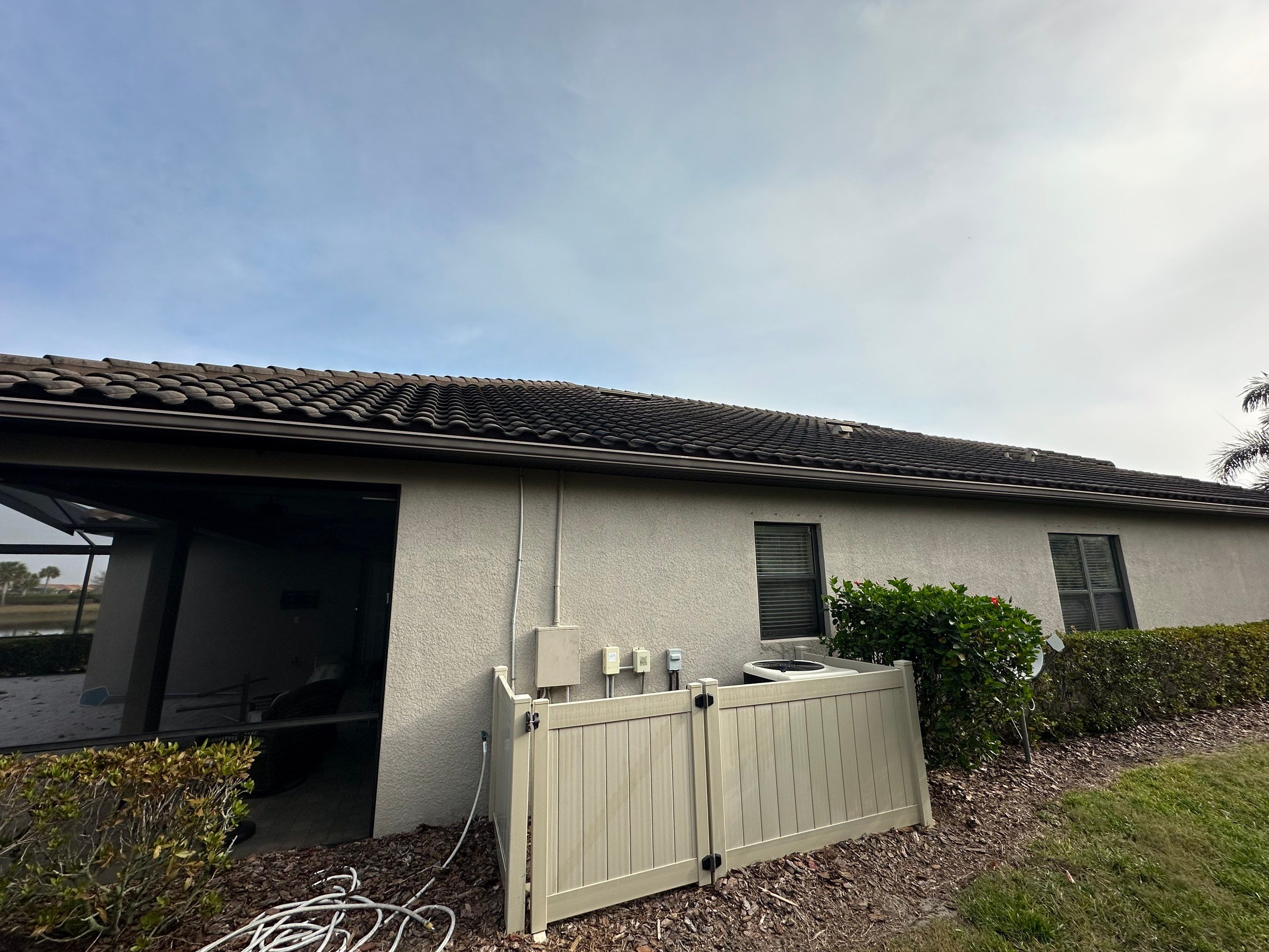Concrete Tile Roof, Paver Pool Deck, Screen Enclosure & Driveway Cleaning in Artisan Lakes Esplanade, Palmetto, FL | Sunshine AquaWash by Sunshine AquaWash