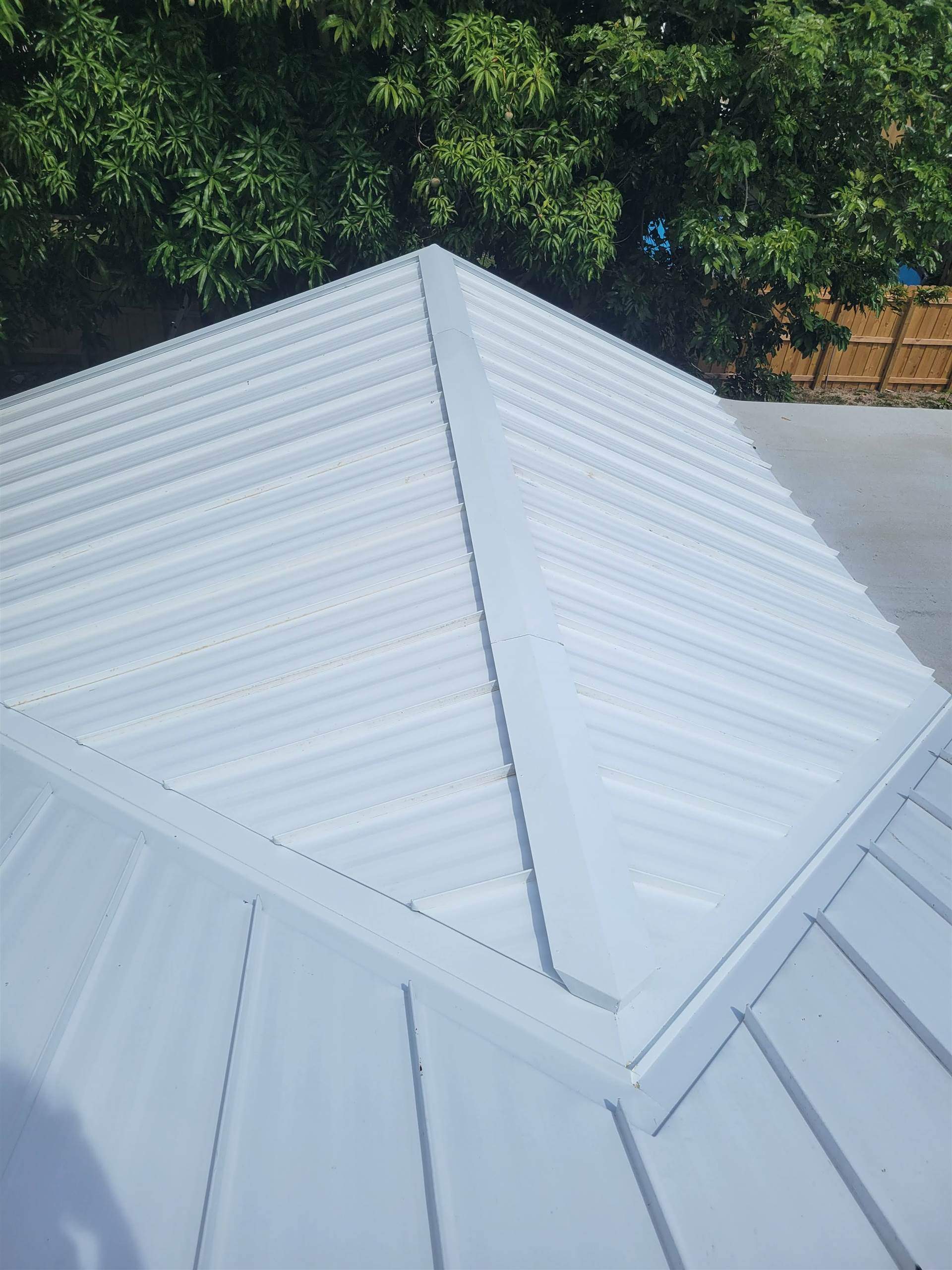 Standing Seam Metal & Flat Re-Roof using 1.5" Nail Strip 24ga Solar White Kynar Coated Standing Seam Metal Panels by Morton Roofing, Inc.