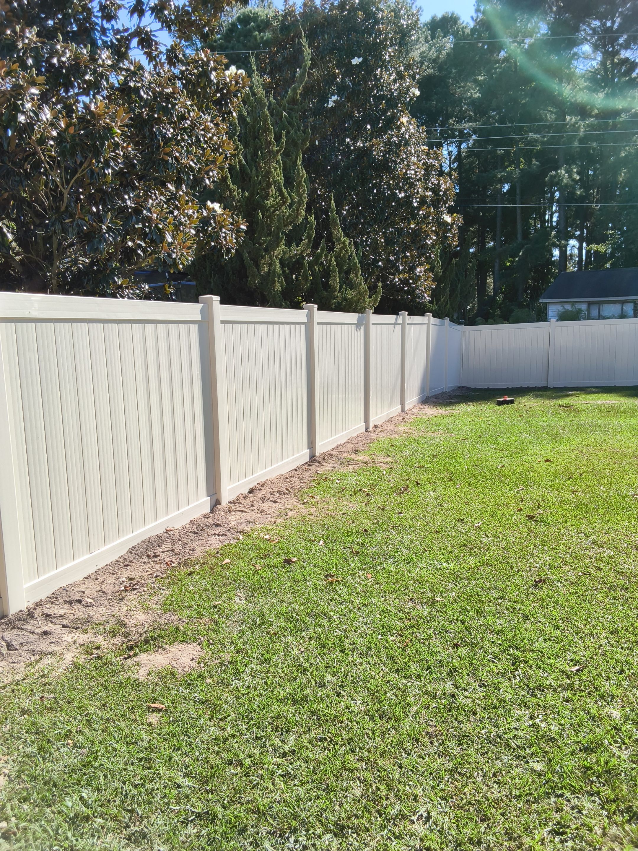 Custom Tan Vinyl Privacy Fence Installation with Double Gates in Winterville by Superior Fence and Rail