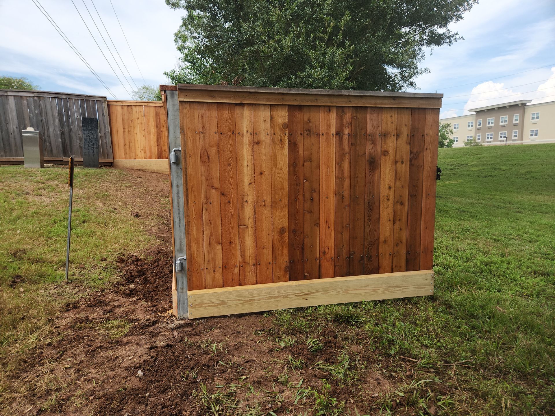 Wood Fence Installation for HOA by Tim's Fences