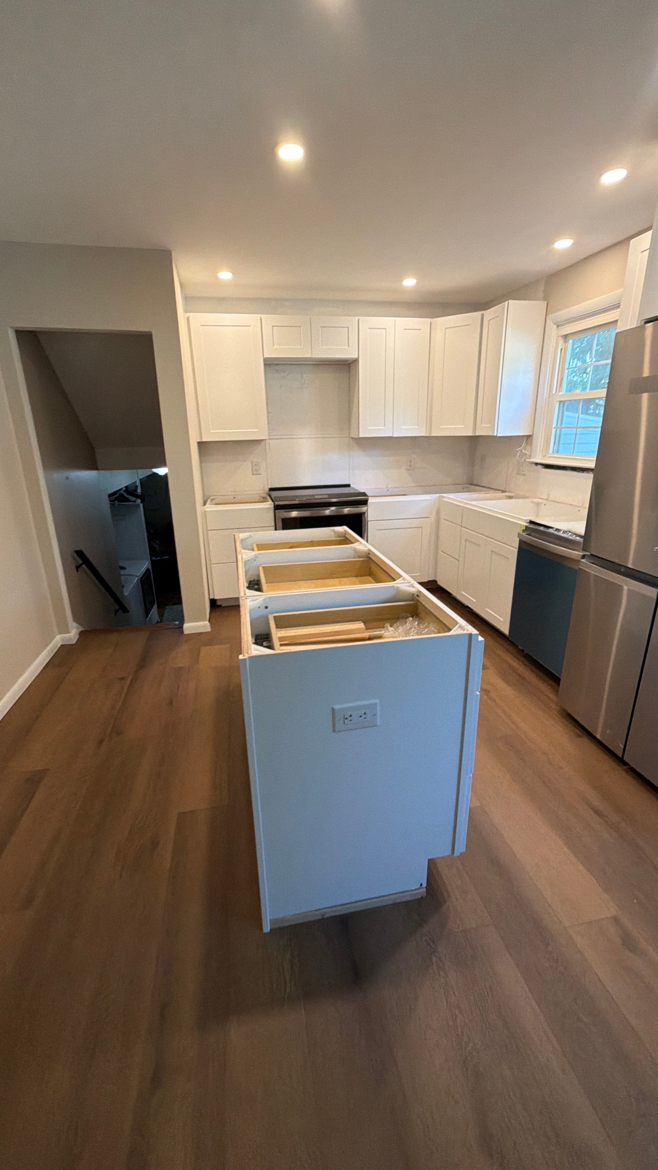 Phoenixville Kitchen Remodel with White Shaker Cabinets and Green Backsplash by Reliable General Contracting