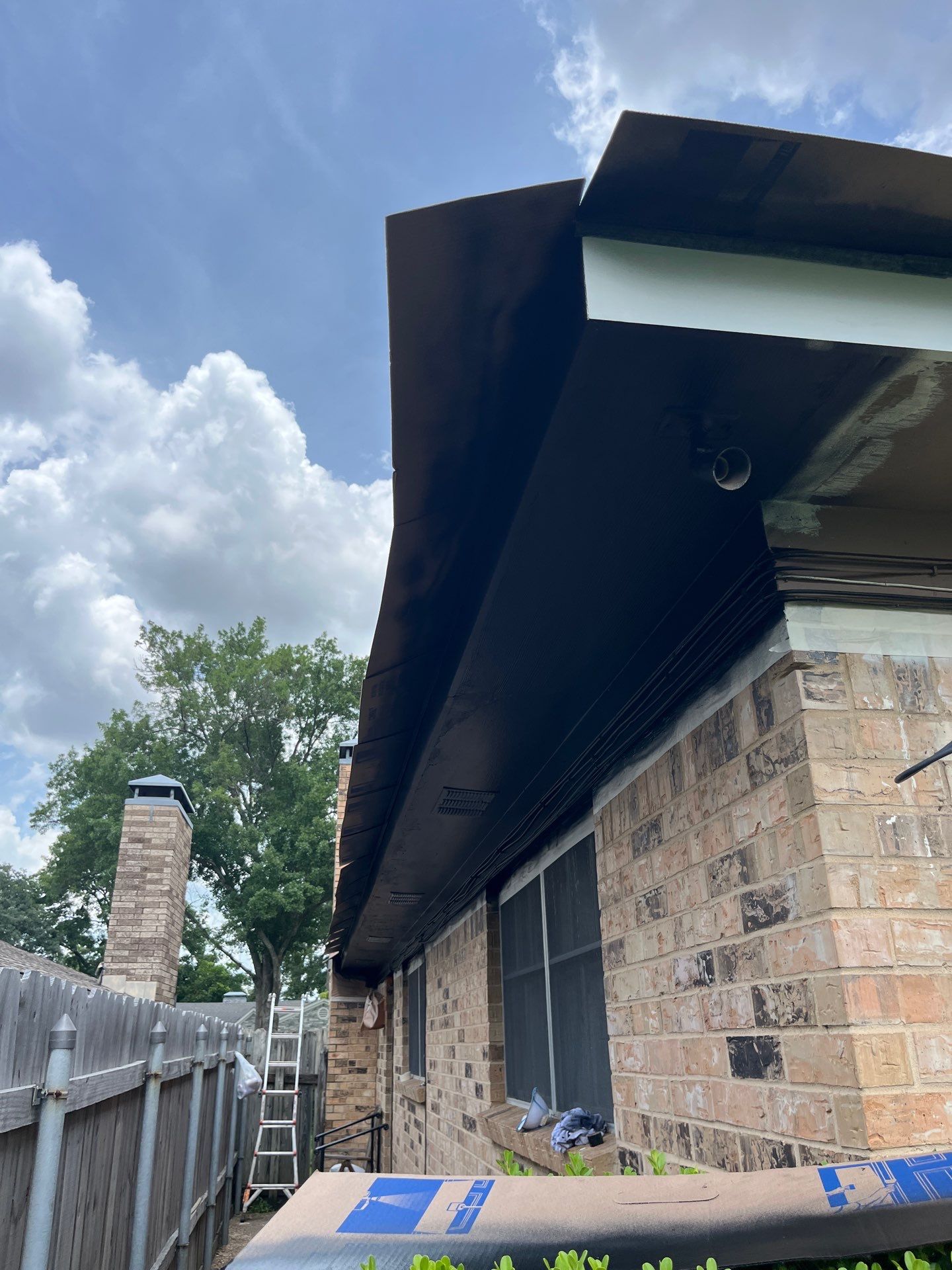 Exterior Painting in Tyler, TX | Eaves, Door & Columns in Elegant Black by Quality Coats Painting